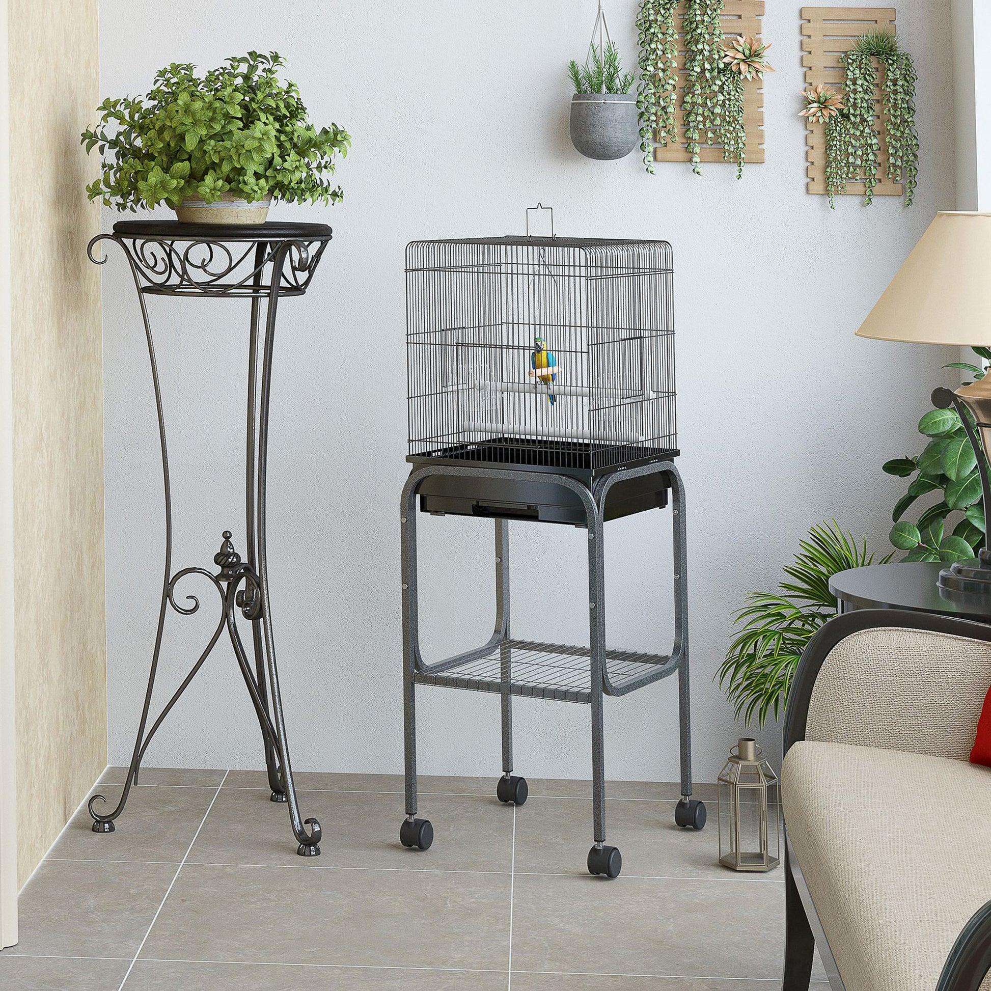 Black wire bird cage on stand with a colorful parrot perfect for small birds