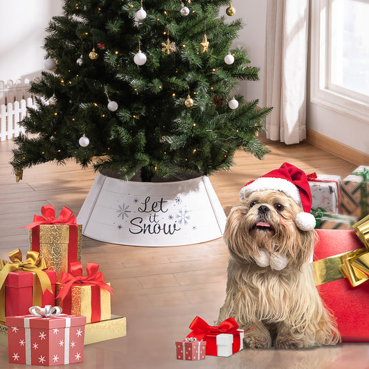 Festive Shih Tzu in Santa hat sits by a Christmas tree with colorful gift boxes