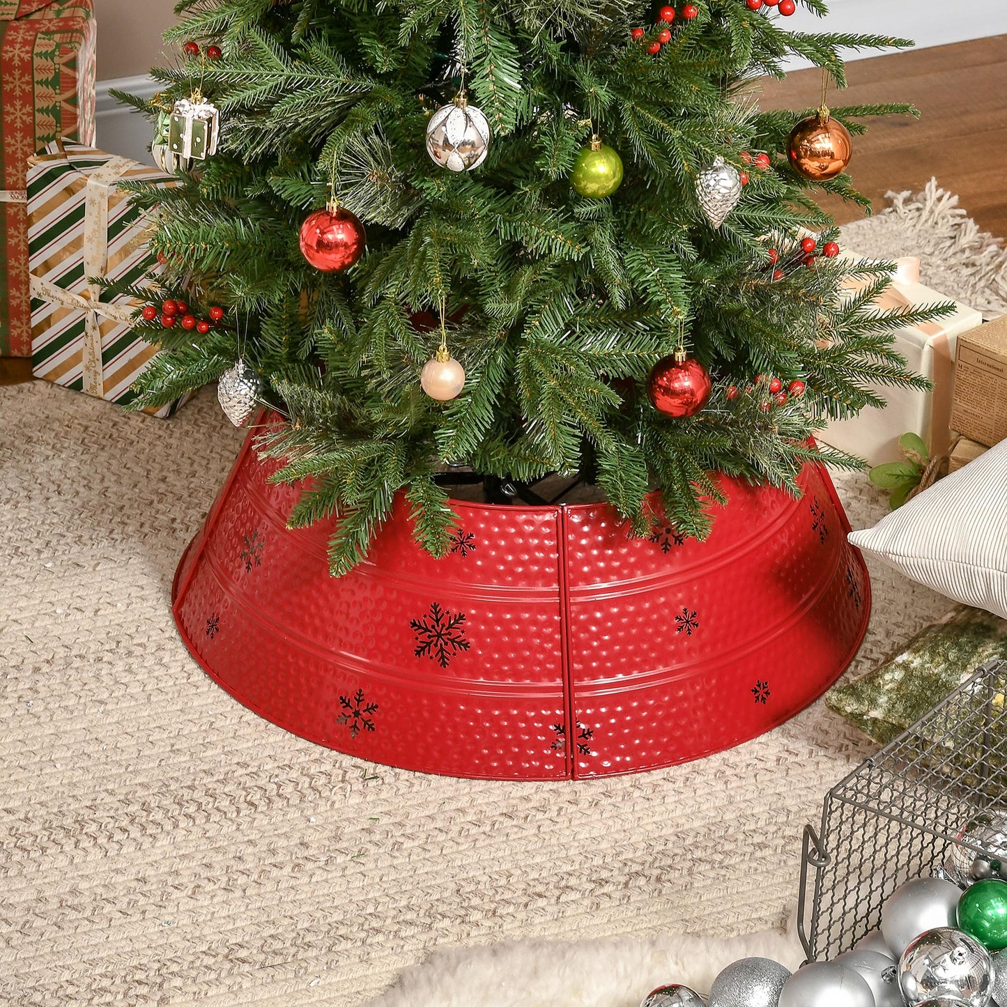 Red hammered metal christmas tree skirt with black snowflakes