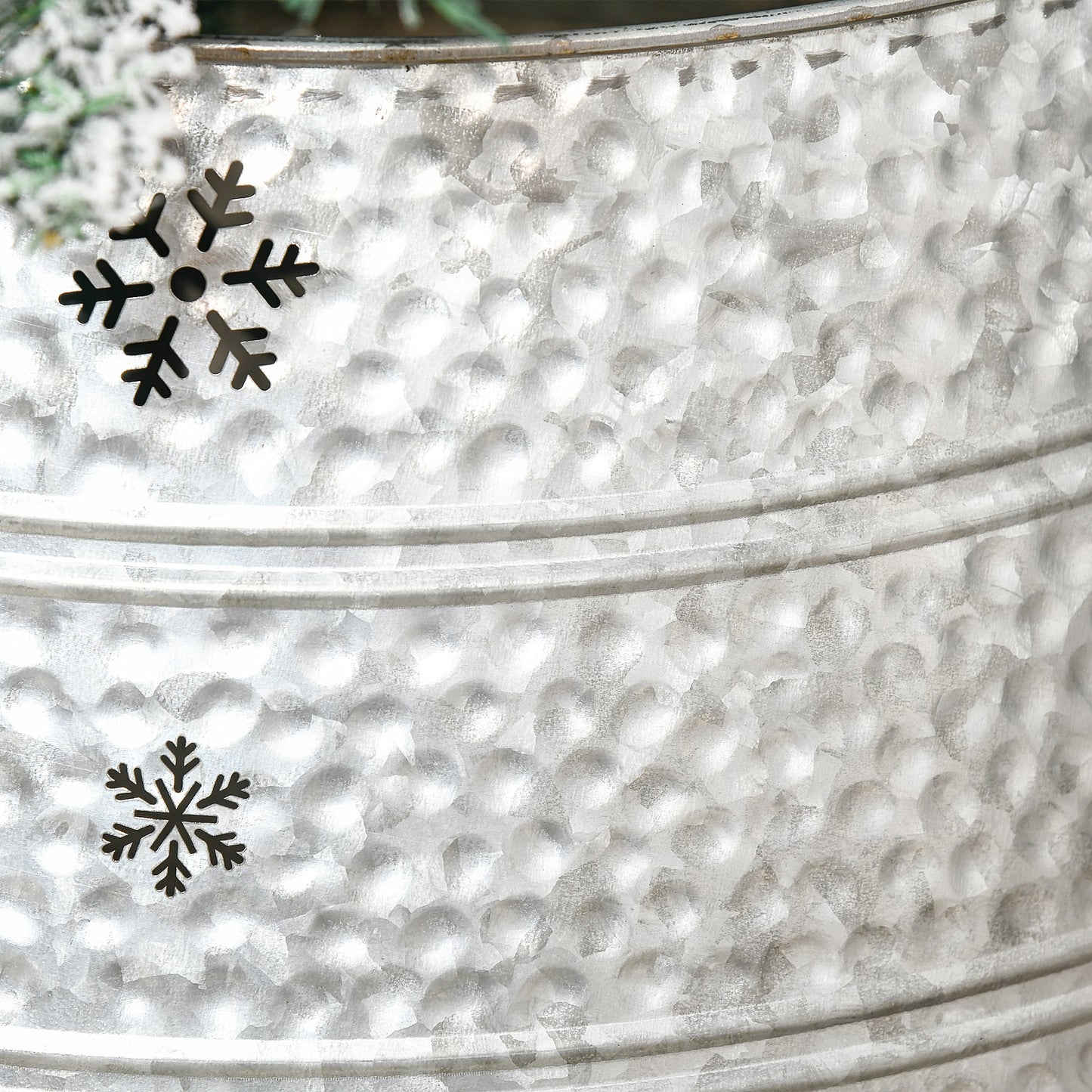 Galvanized metal bucket with two festive snowflake ornaments perfect for winter decor