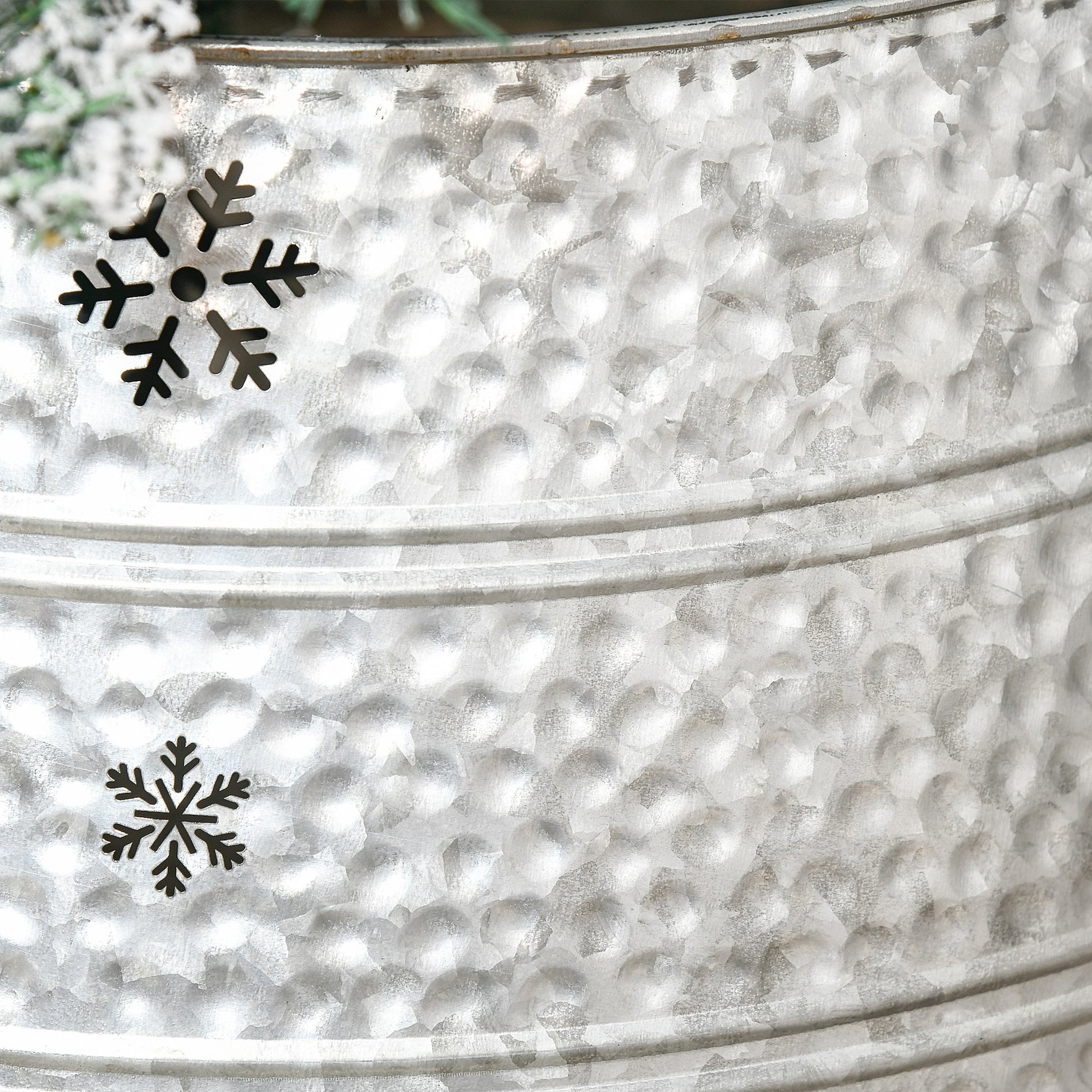 Galvanized metal bucket with two festive snowflake ornaments perfect for winter decor