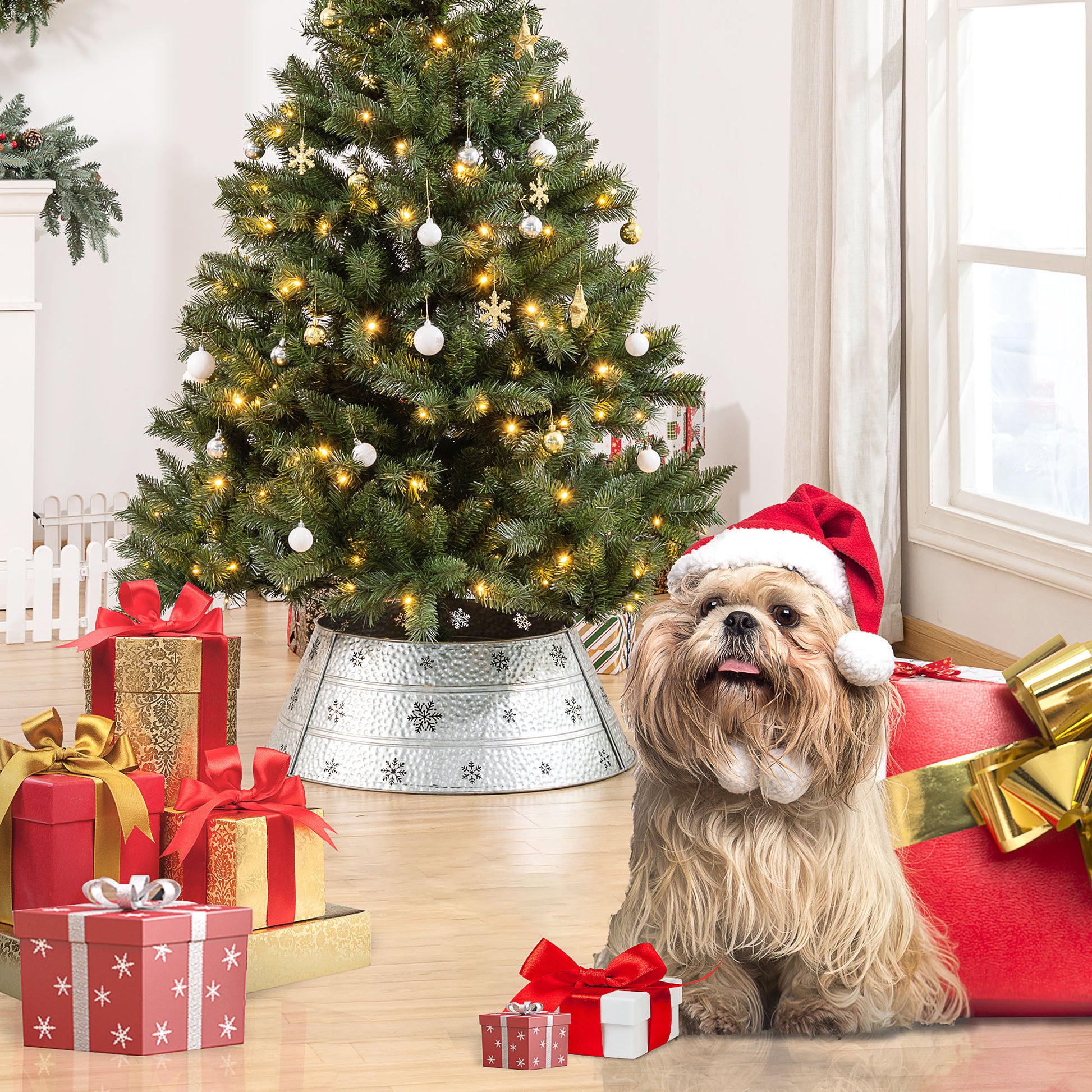 Fluffy dog wearing Santa hat with festive gifts and Christmas tree