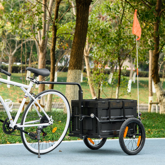 Black folding bicycle cargo trailer with orange safety flag and reflectors