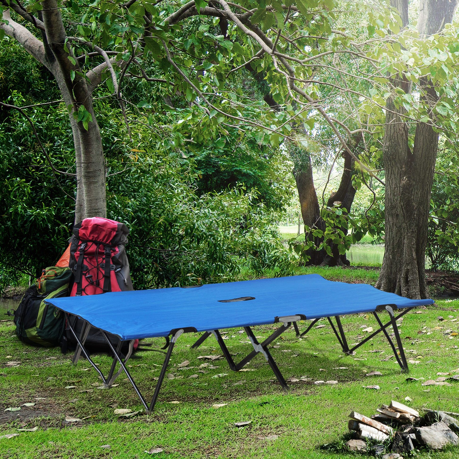 Blue foldable camping cot with sturdy metal frame set up on grass