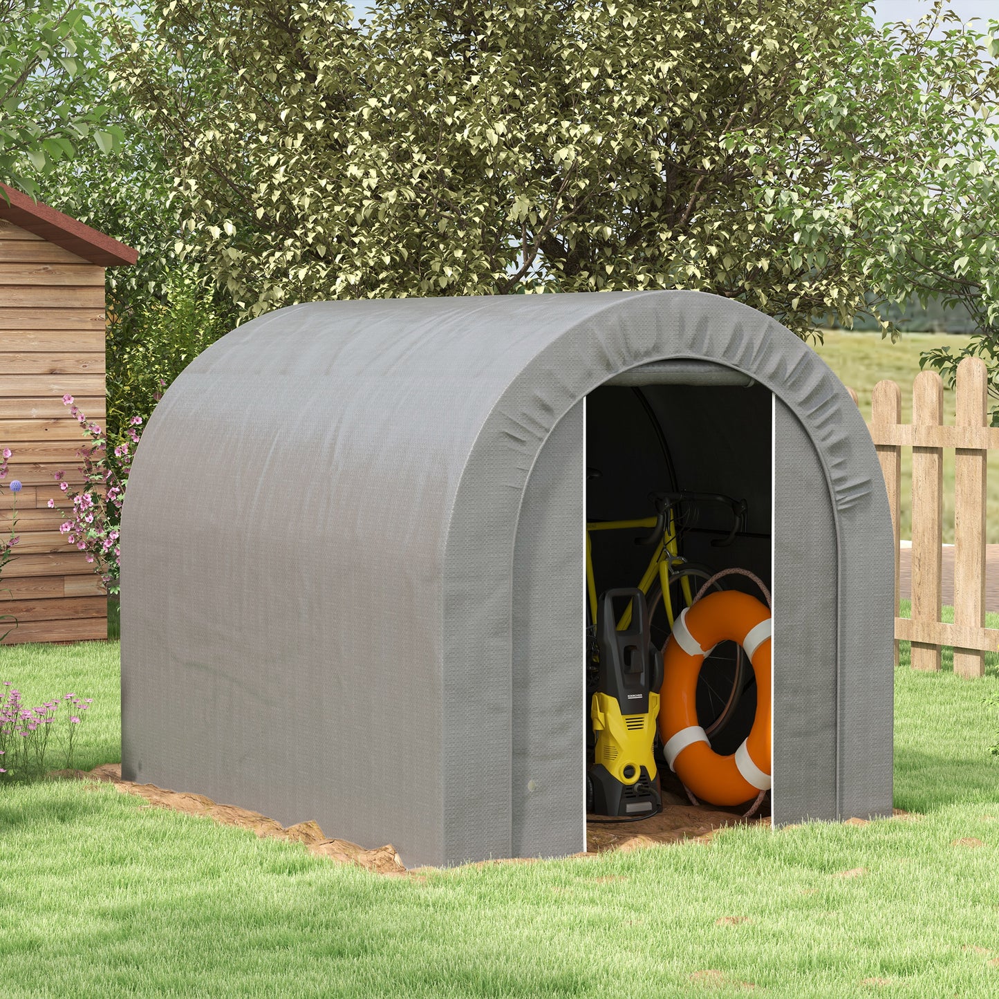 Gray arched outdoor storage shed with yellow bicycle orange life preserver and pressure washer inside