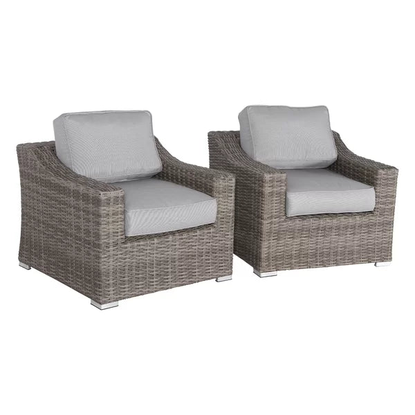Two grey wicker patio chairs with plush light grey cushions