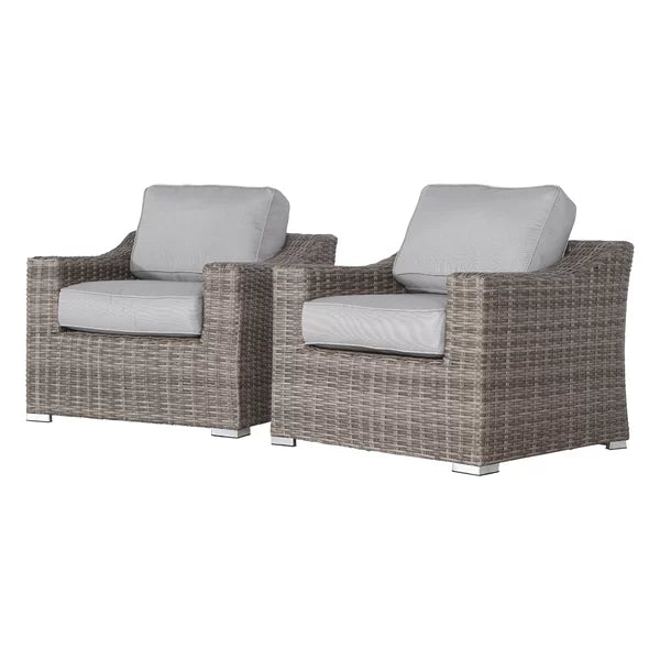 Two grey wicker armchairs with light grey cushions perfect for outdoor relaxation