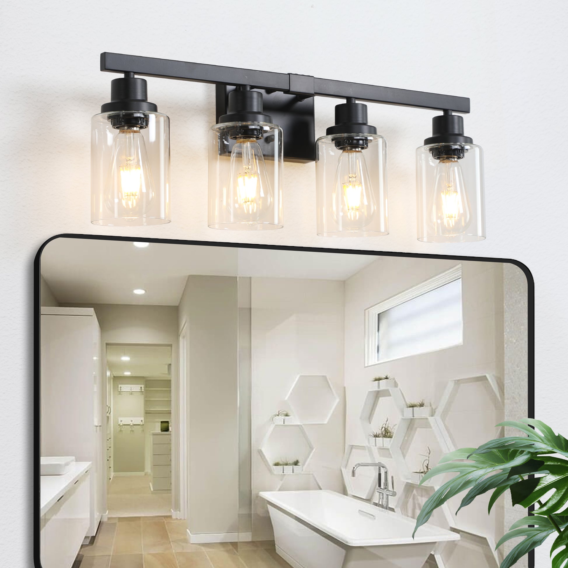 Modern black light vanity light with clear glass shades and exposed Edison bulbs