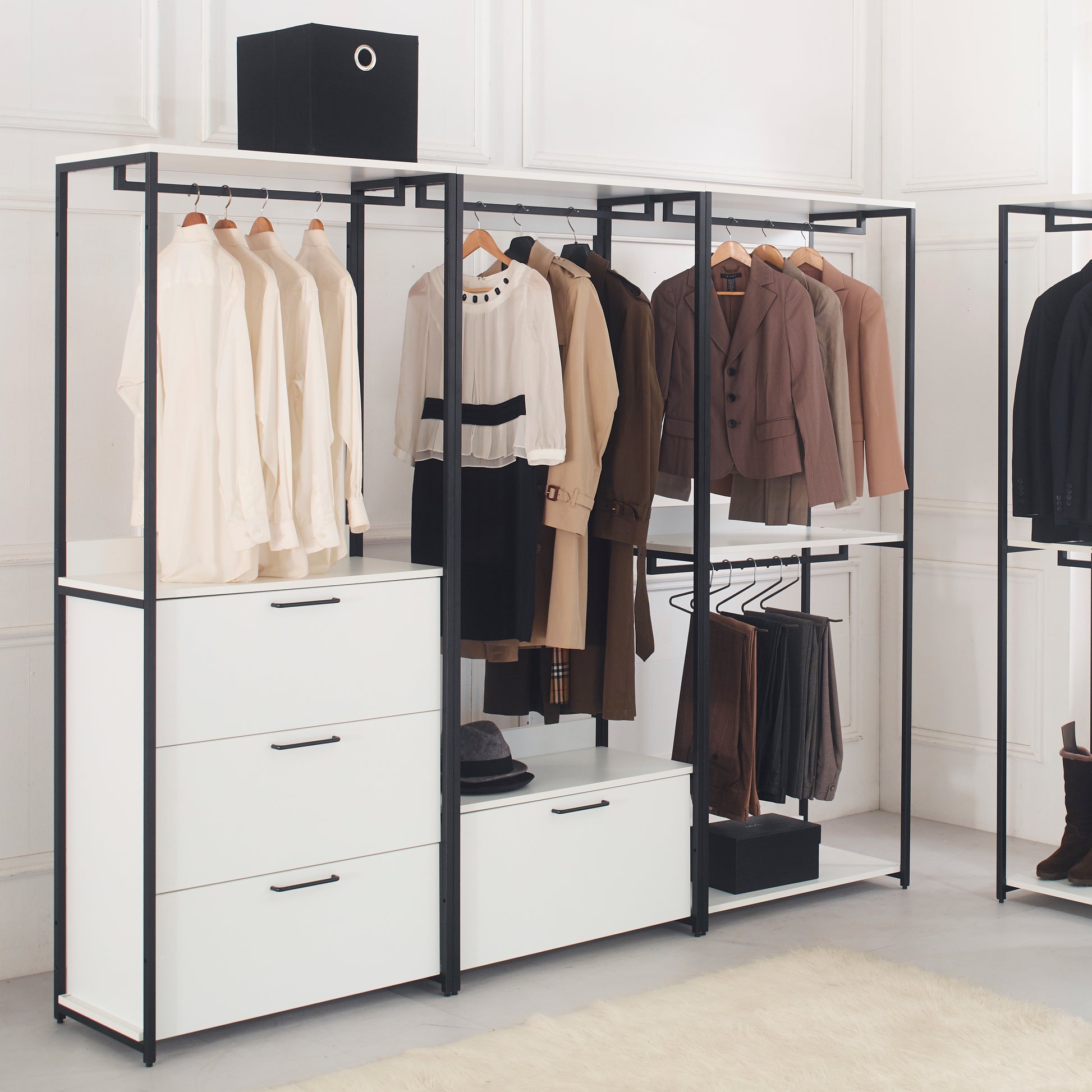Modern minimalist clothing rack with white drawers and black frame