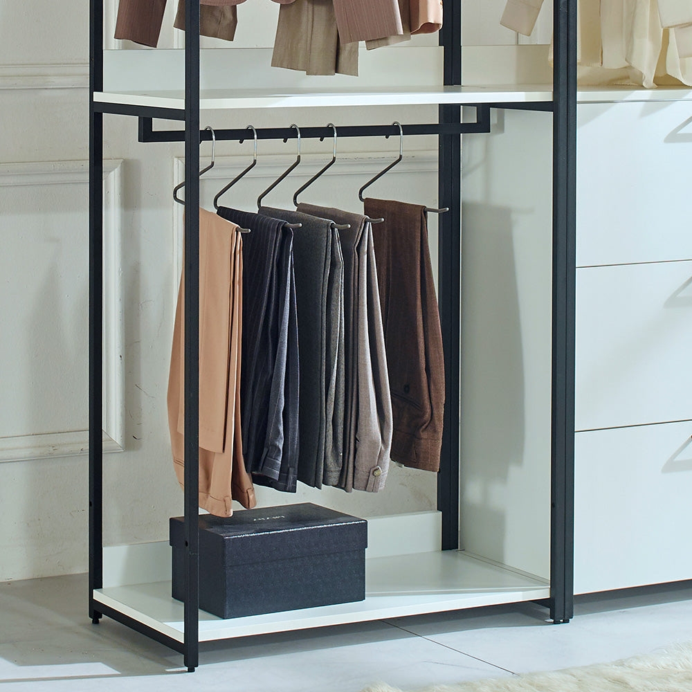 Tan dress pants hanging on a closet rod