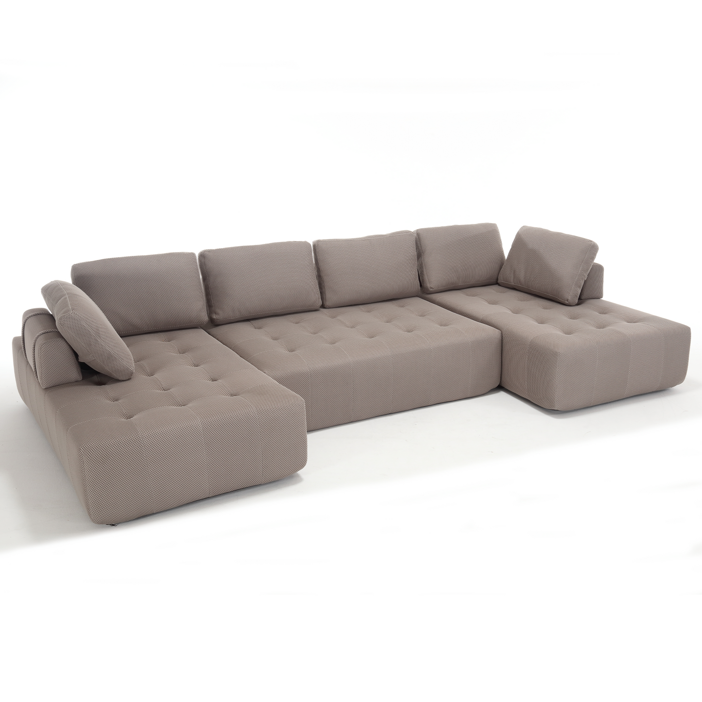 Taupe sectional sofa with tufted cushions and geometric patterned fabric