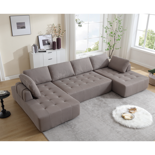 Modern taupe sectional sofa with tufted cushions and plush armrests