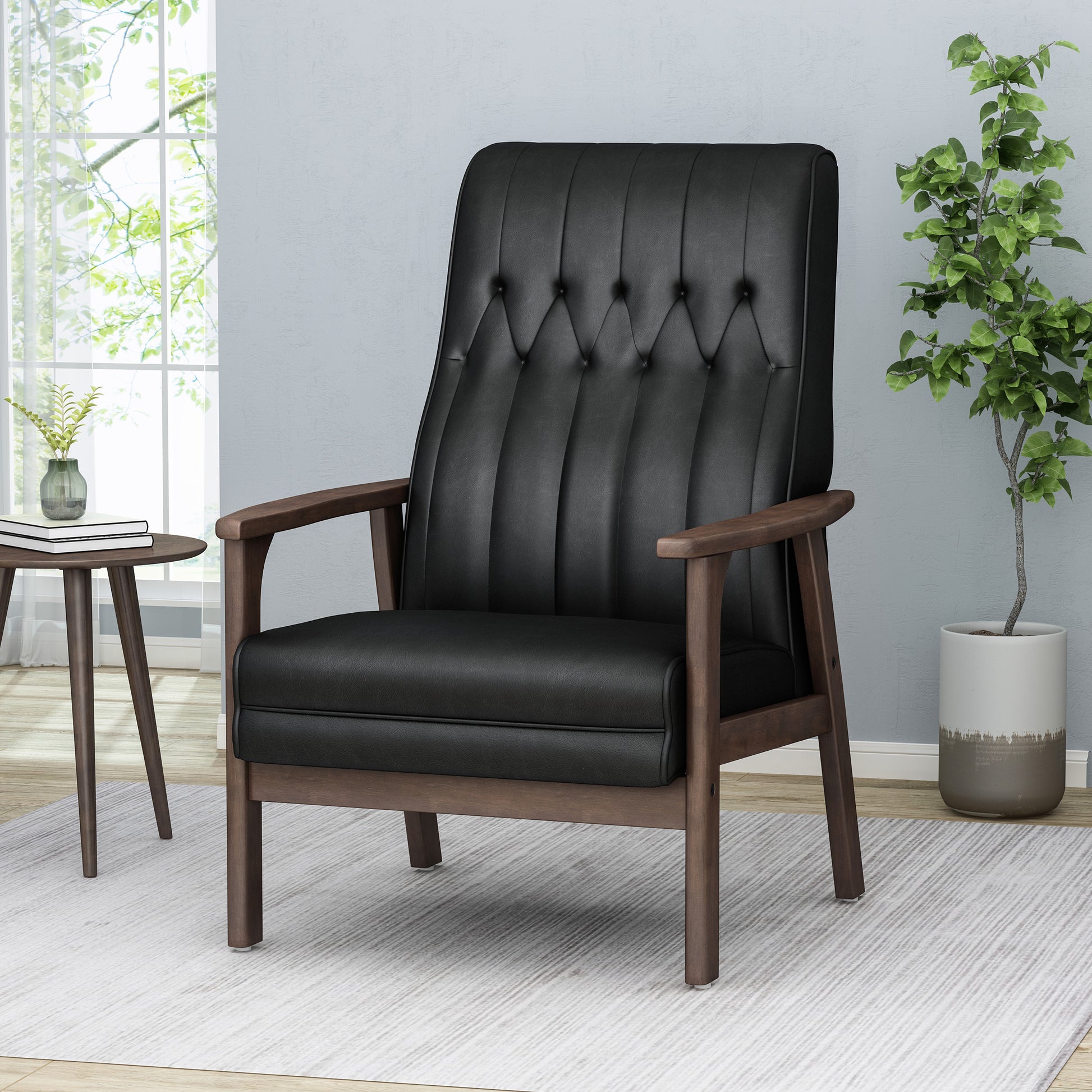 Tufted black faux leather armchair with wooden frame and arms for modern living rooms