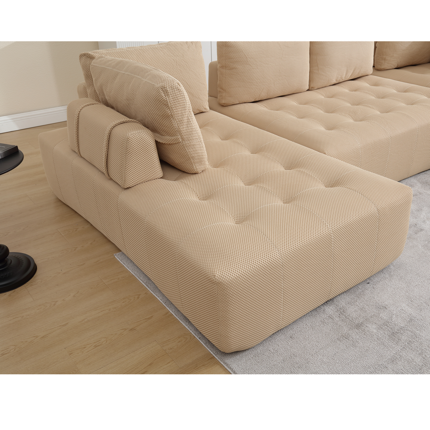 Beige textured fabric sectional sofa with tufted cushions for living room comfort