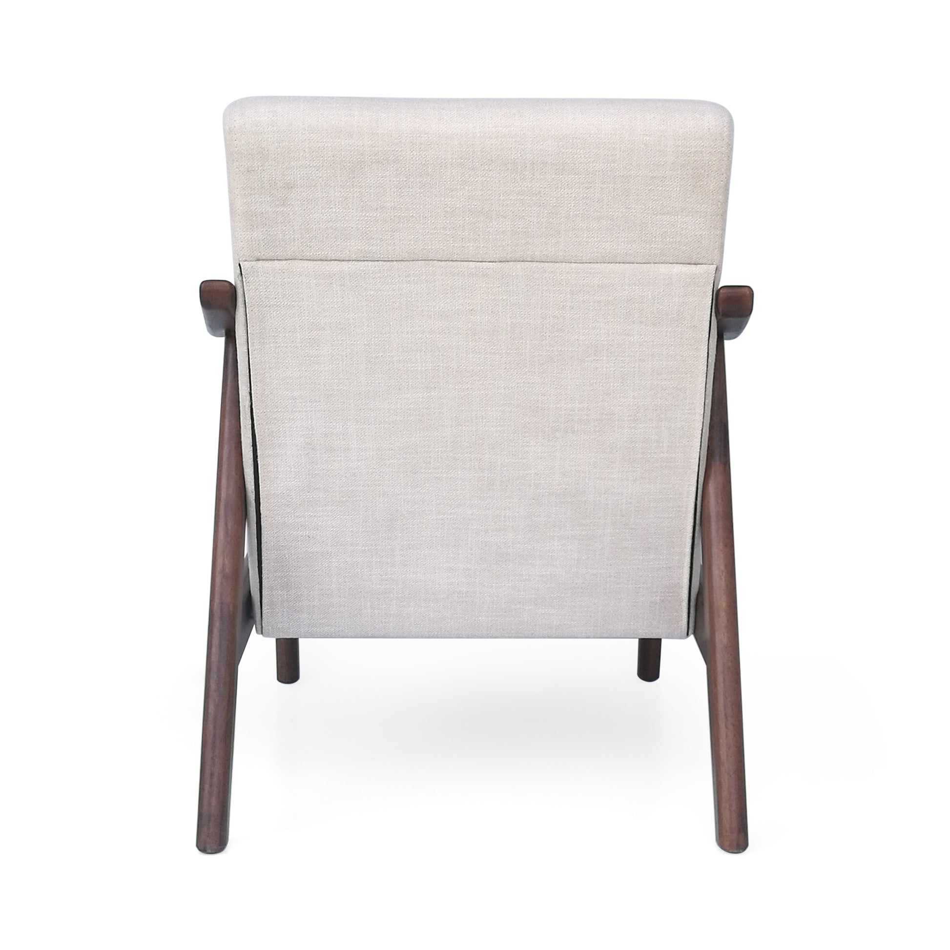 Back view of a modern beige fabric armchair with dark wood legs and arms