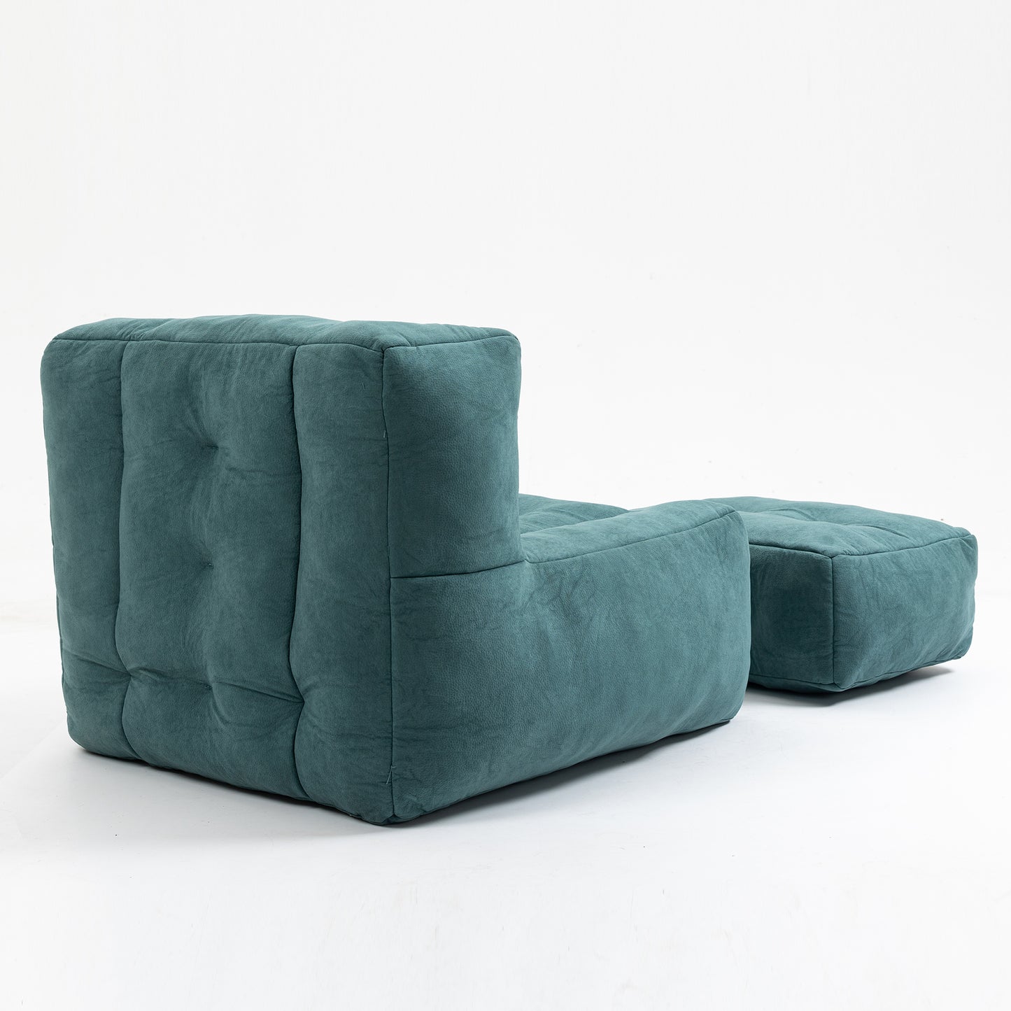 Teal velvet modular sofa with tufted seat and back shown with ottoman