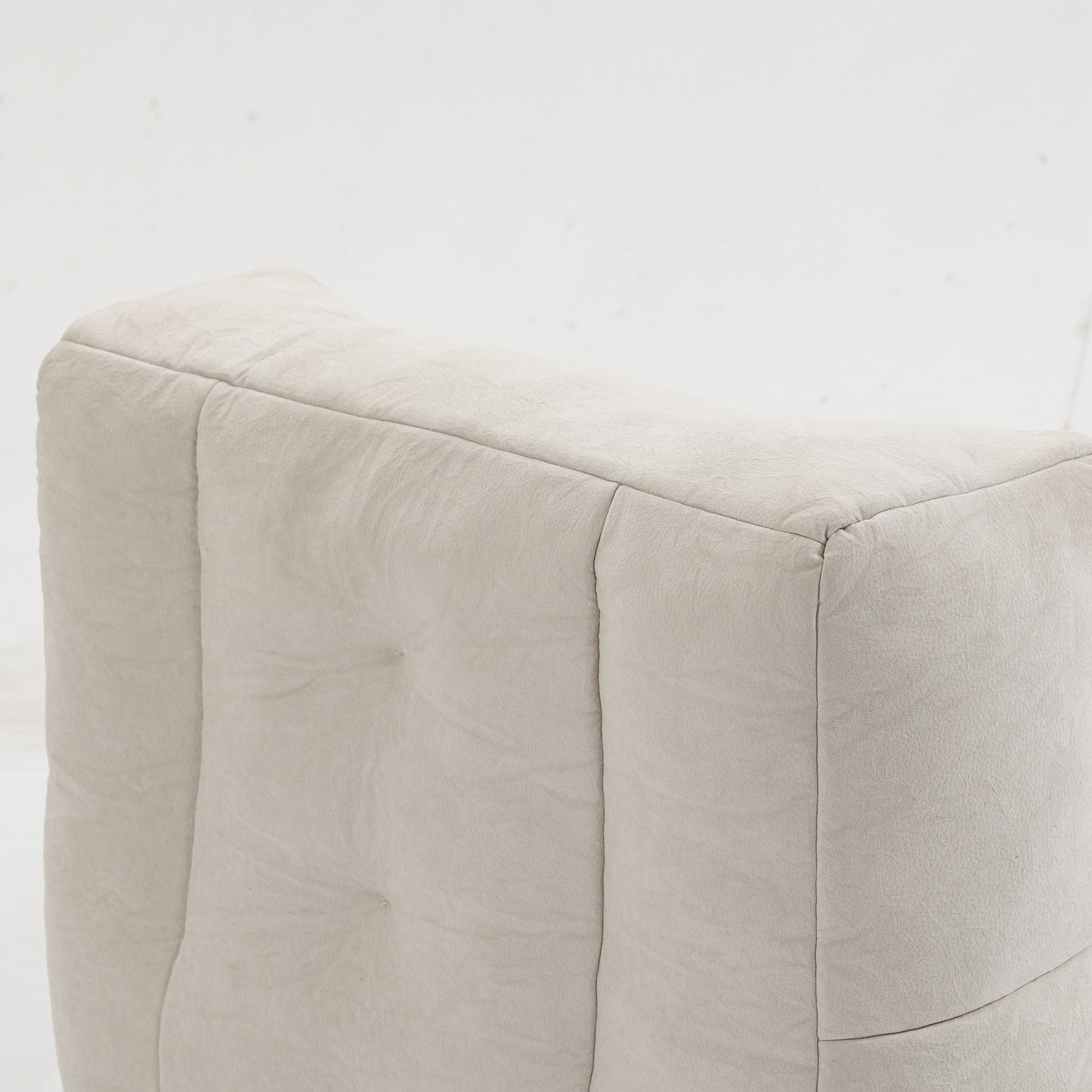 Tufted beige linen fabric upholstered ottoman with deep button details for modern living rooms