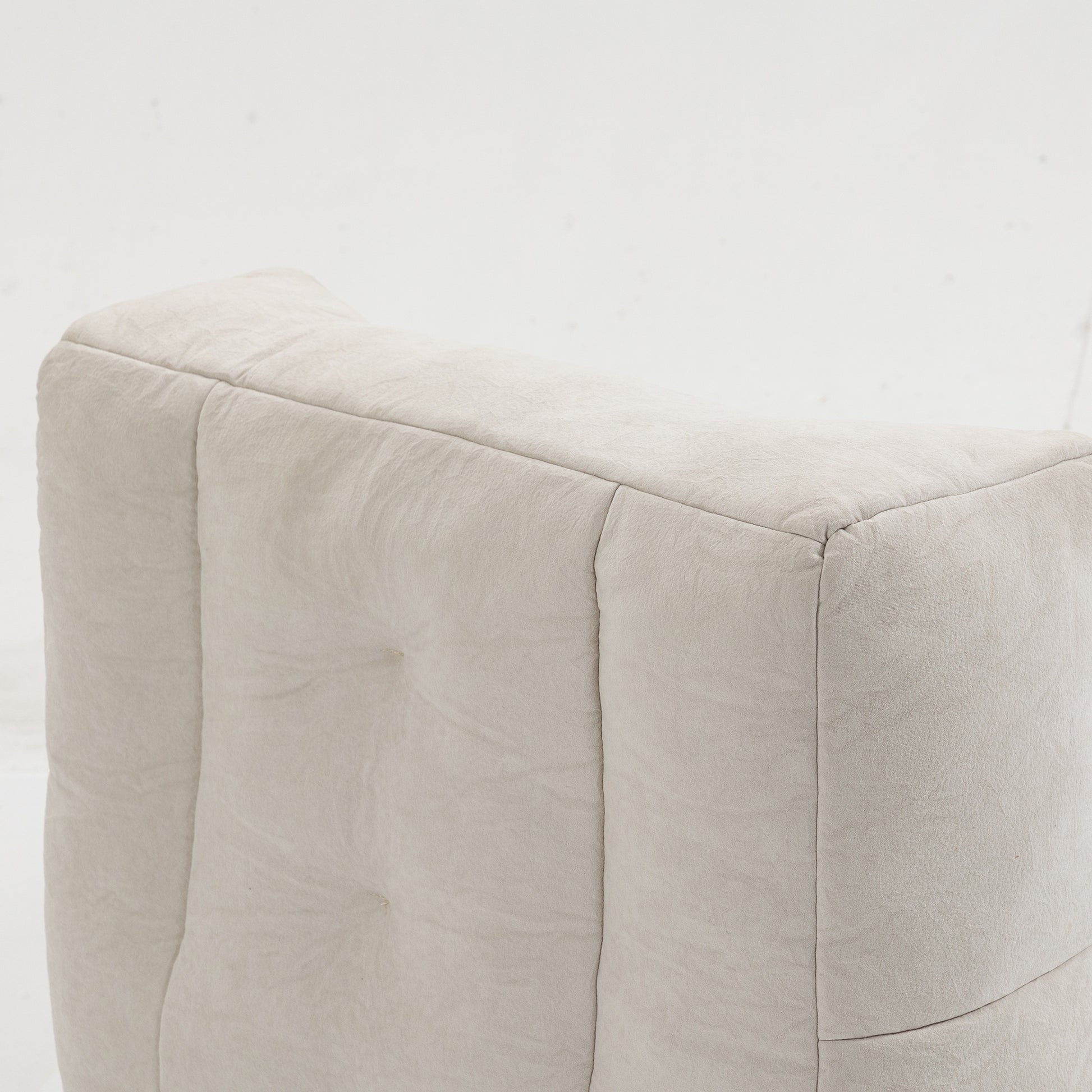 Tufted beige linen fabric upholstered ottoman with deep button details for modern living rooms
