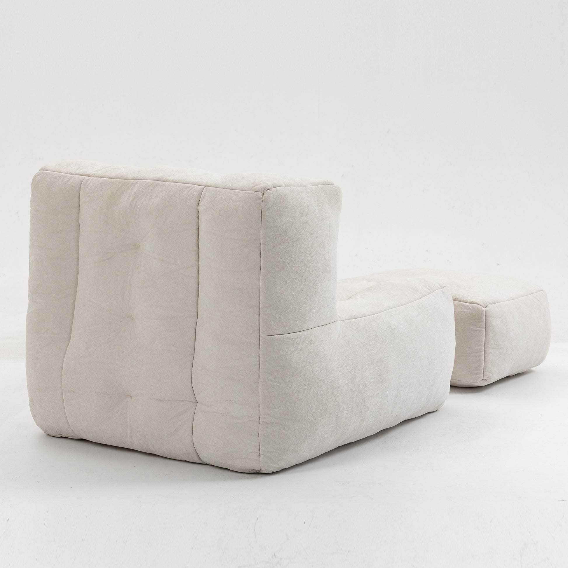 Cream boucle modular armchair with ottoman featuring deep button tufting and contemporary design for living rooms