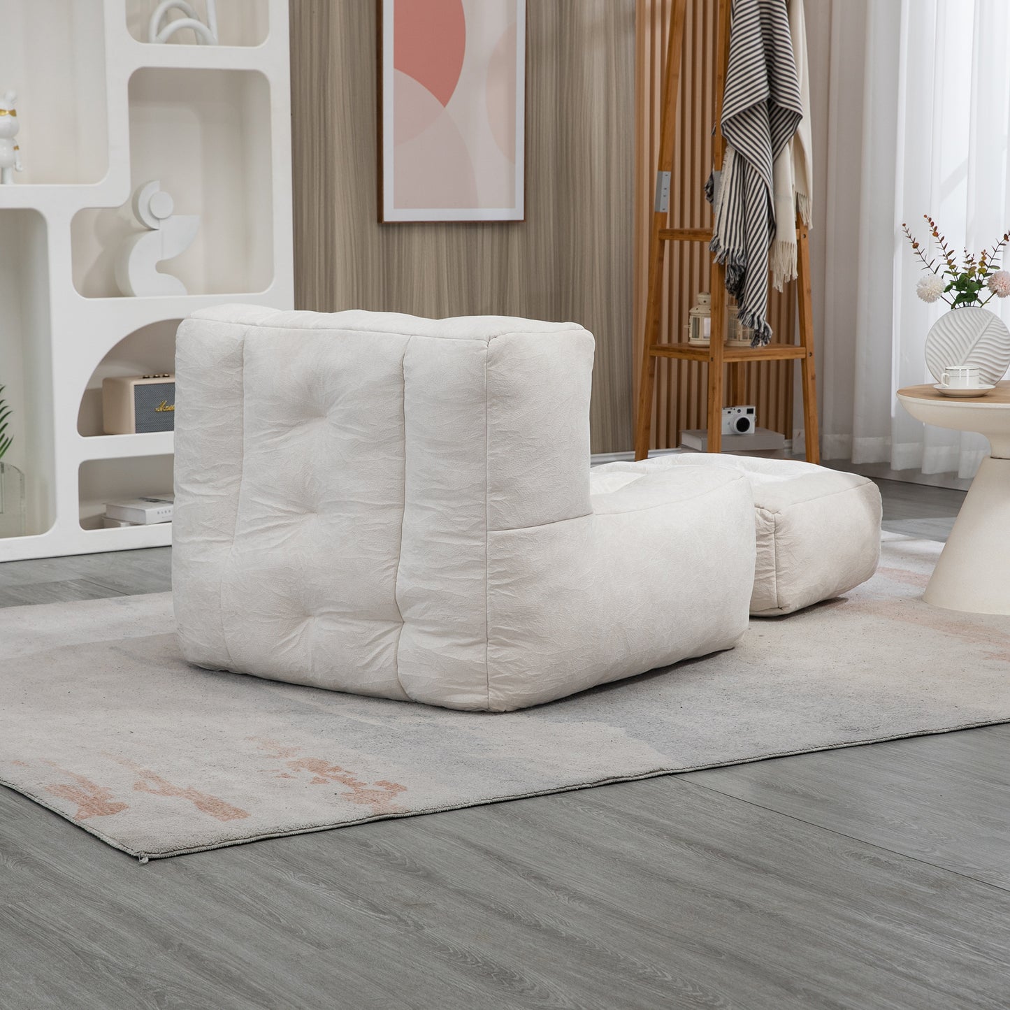 Cream textured modular sofa with ottoman on a rug