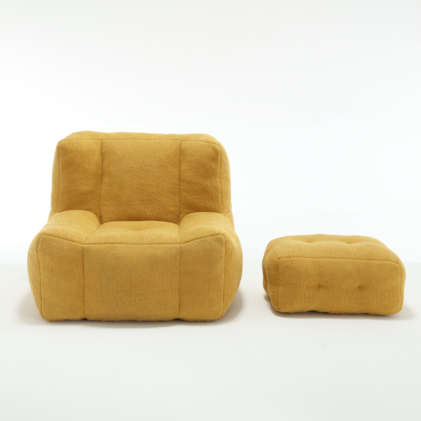 Yellow textured fabric armchair with rounded edges and matching ottoman