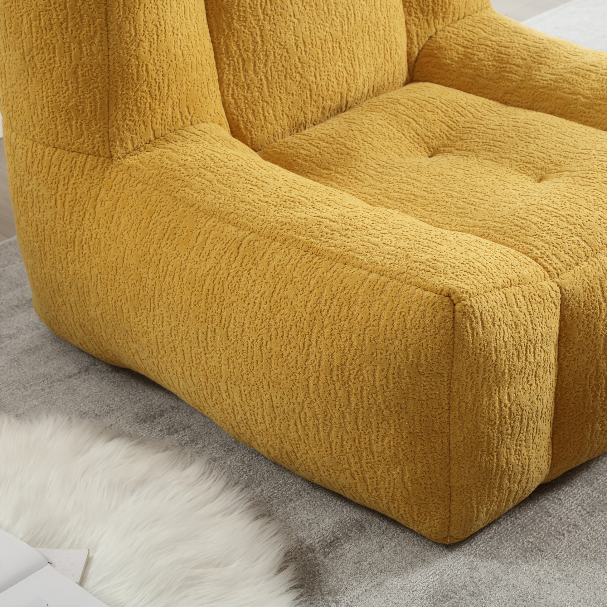 Mustard yellow boucl armchair plush textured fabric modern seating for living rooms
