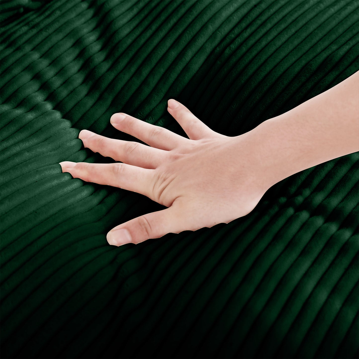 Hand touching soft dark green corduroy fabric texture