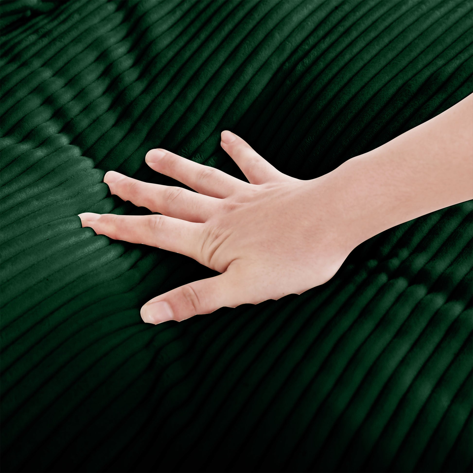 Hand touching soft dark green corduroy fabric texture