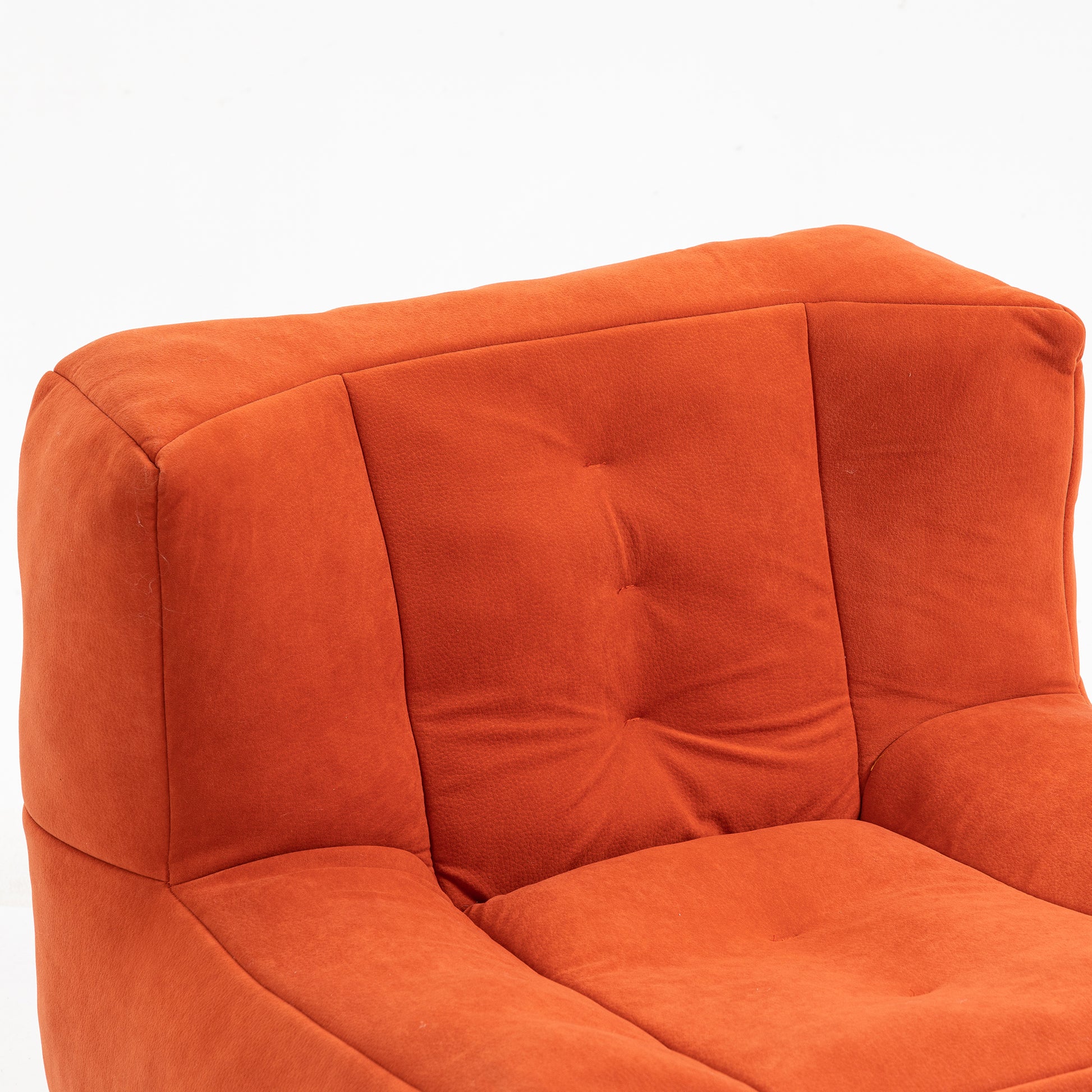 Terracotta textured fabric sofa with tufted backrest and comfortable seating