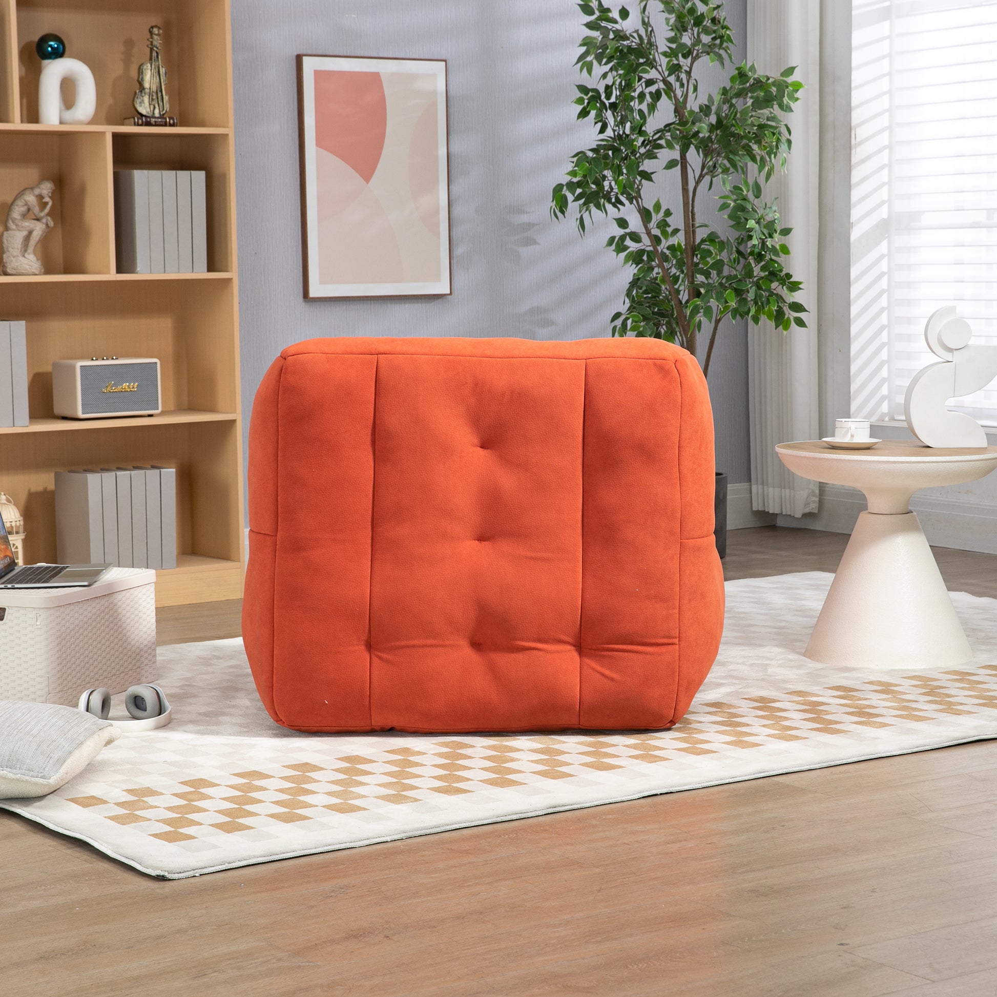 Orange tufted ottoman with fabric upholstery a cozy accent for any living room