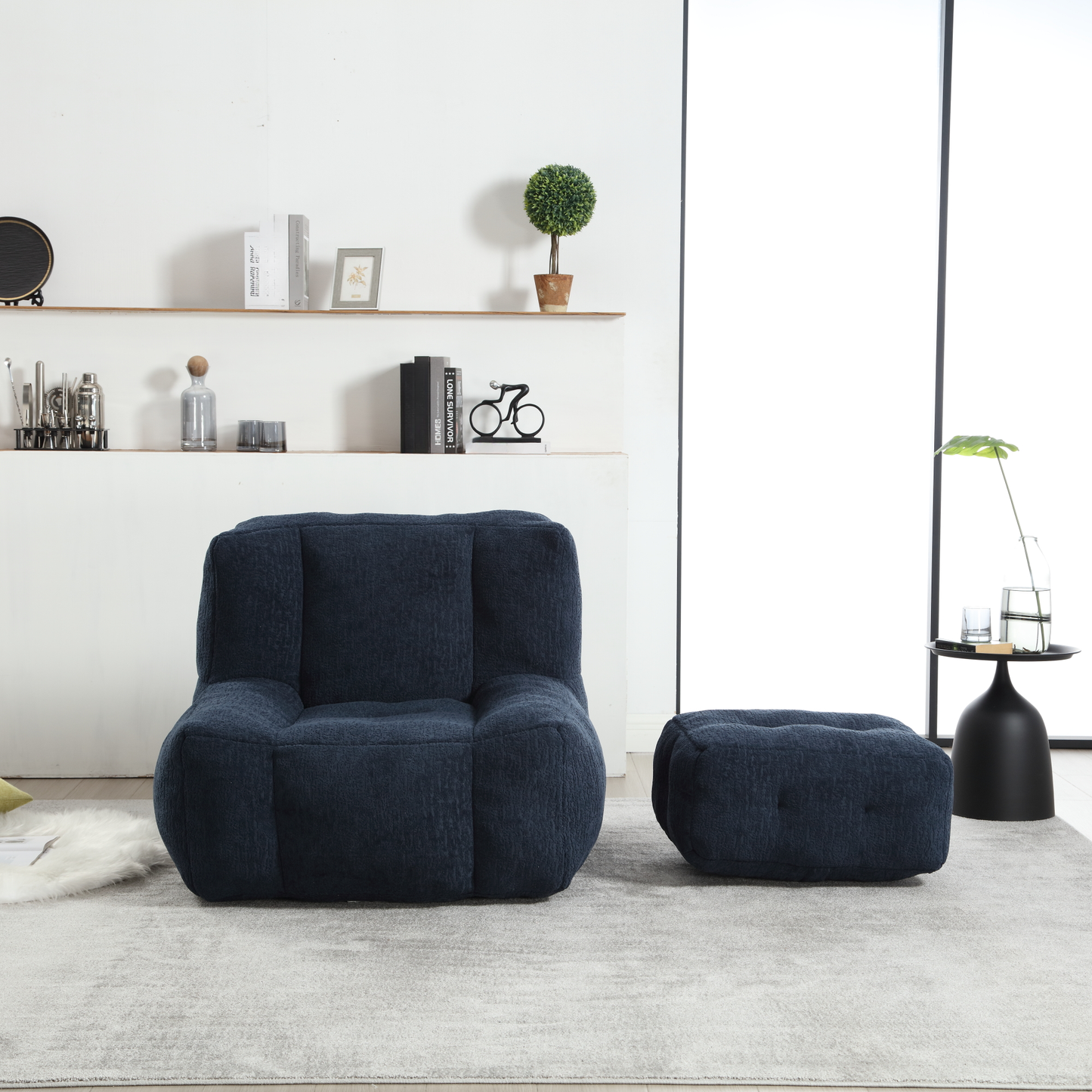 Deep navy plush modular armchair with textured fabric and matching ottoman