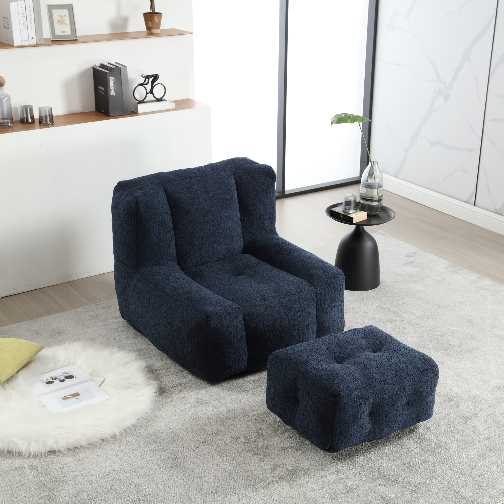 Comfortable navy blue upholstered armchair with matching ottoman for modern living spaces