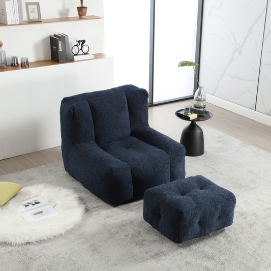 Comfortable navy blue upholstered armchair with matching ottoman for modern living spaces