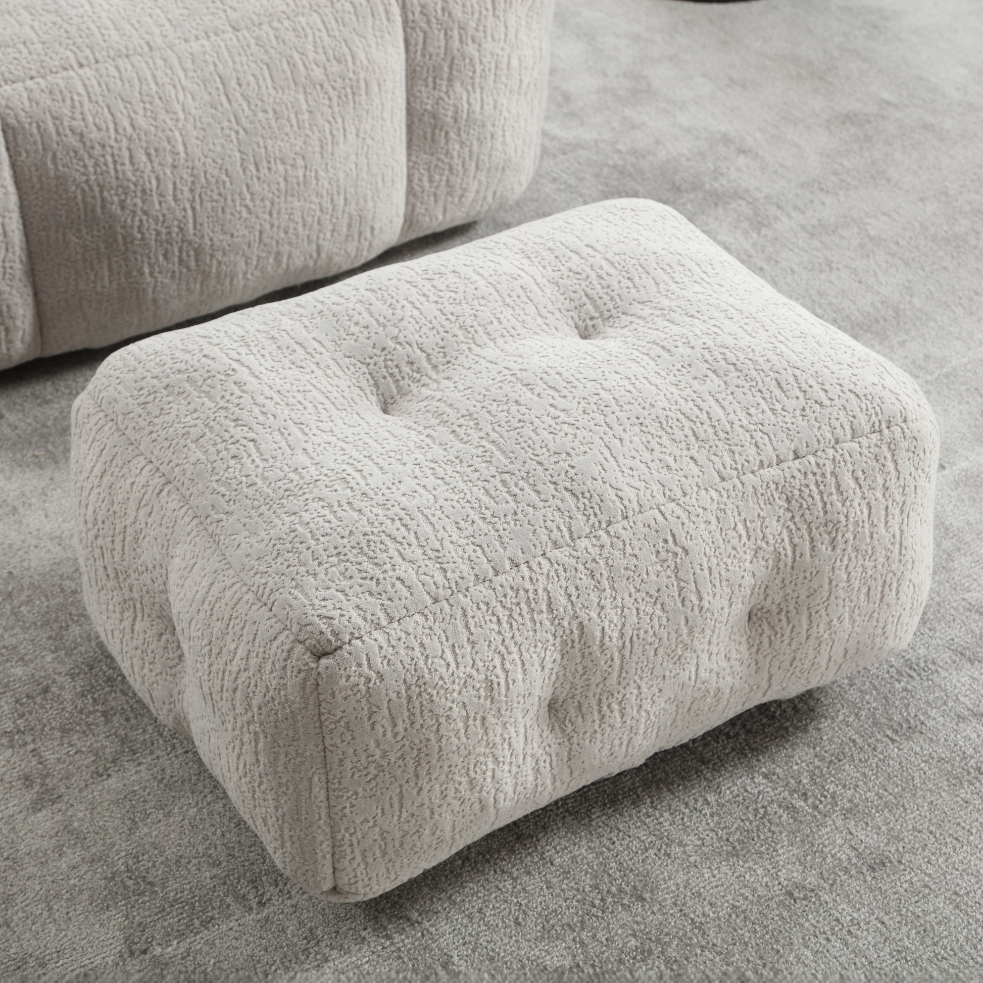 Tufted cream boucle ottoman with textured fabric upholstery perfect for living room footrest