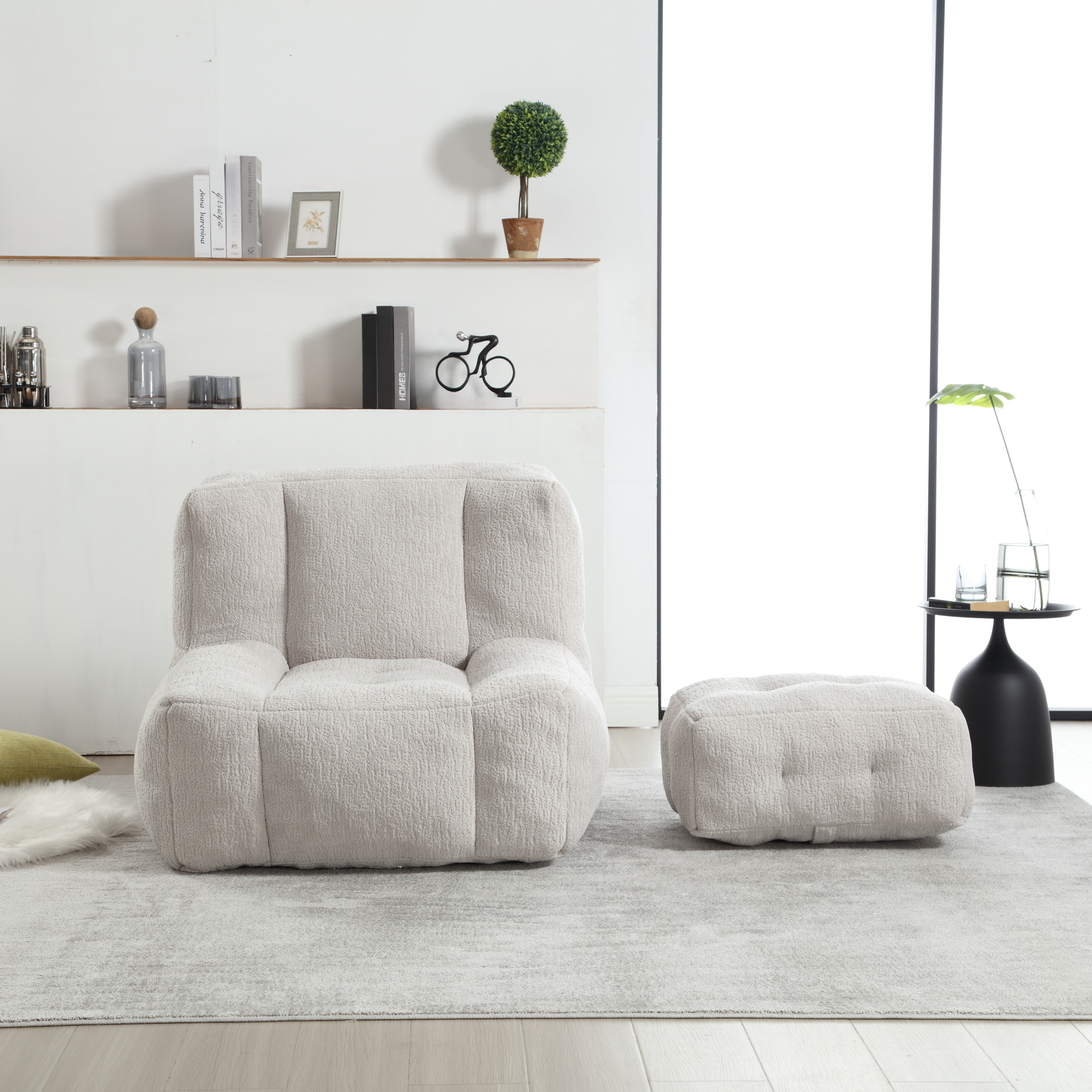 Plush boucle fabric armchair in a light cream color with matching ottoman perfect for a cozy living room