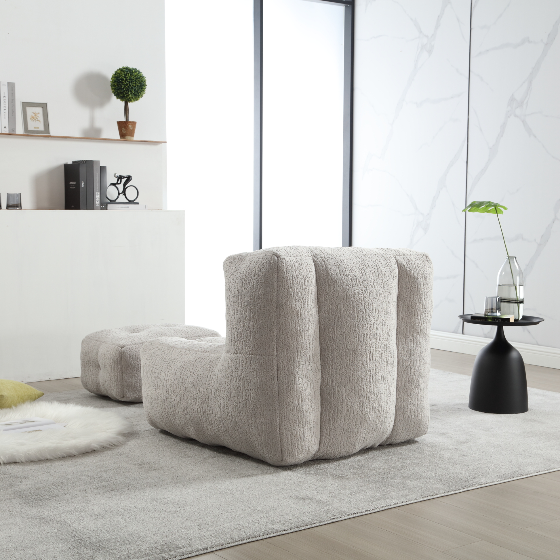 Modern cream boucle armchair with plush cushioning and matching ottoman for contemporary living rooms