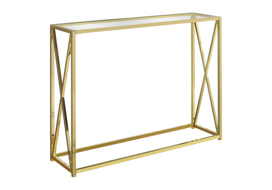 Gold metal console table with a clear glass top and xframe legs
