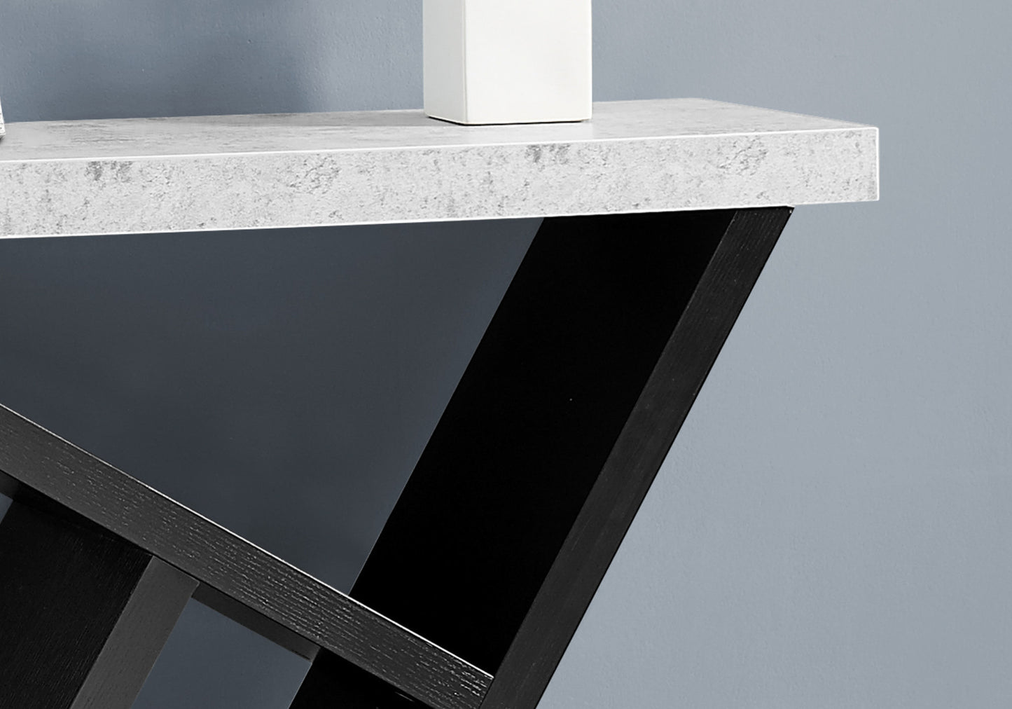 Modern minimalist console table with white marblelook top and black wooden frame