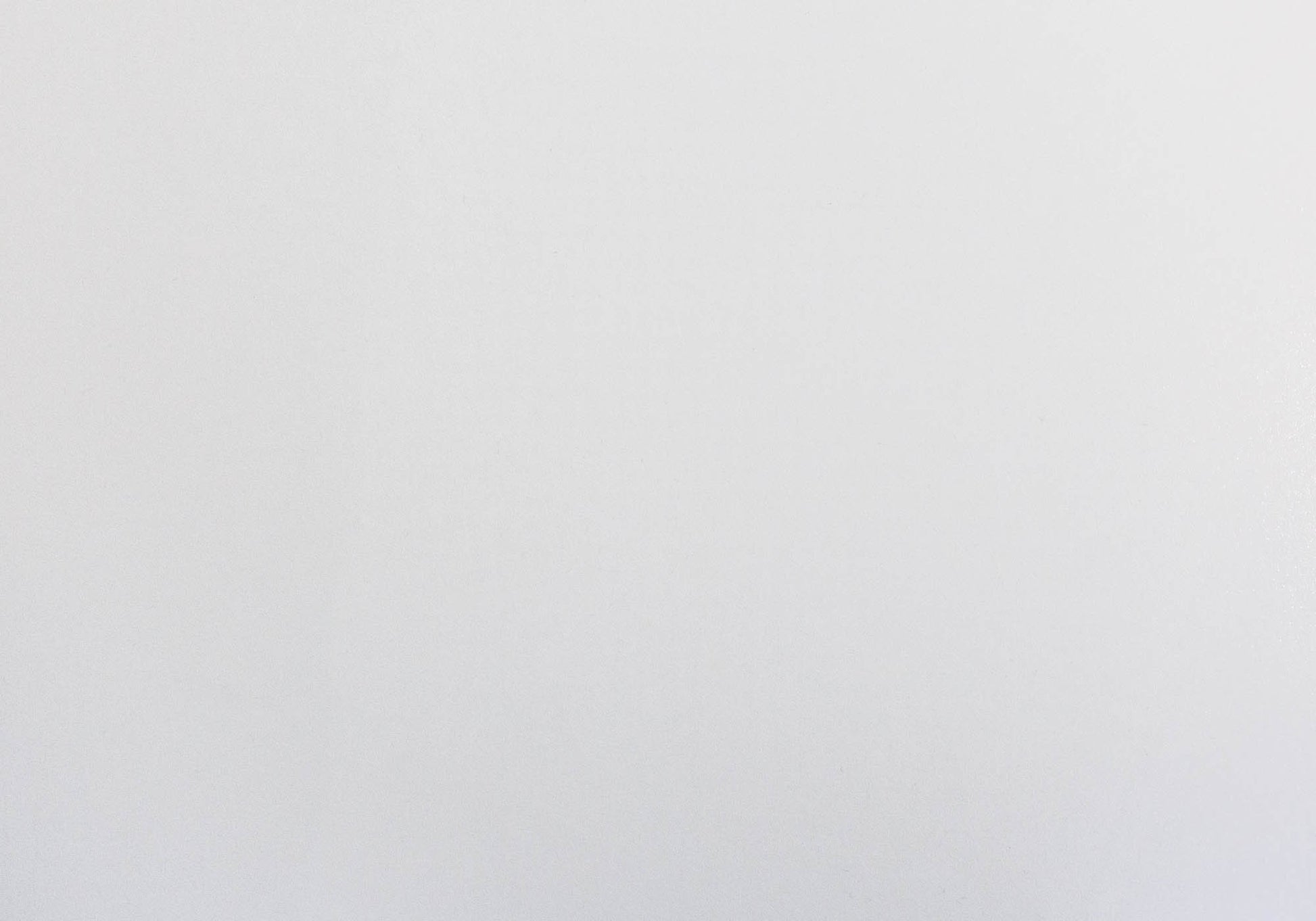 Closeup texture of a smooth white ceramic tile for kitchens