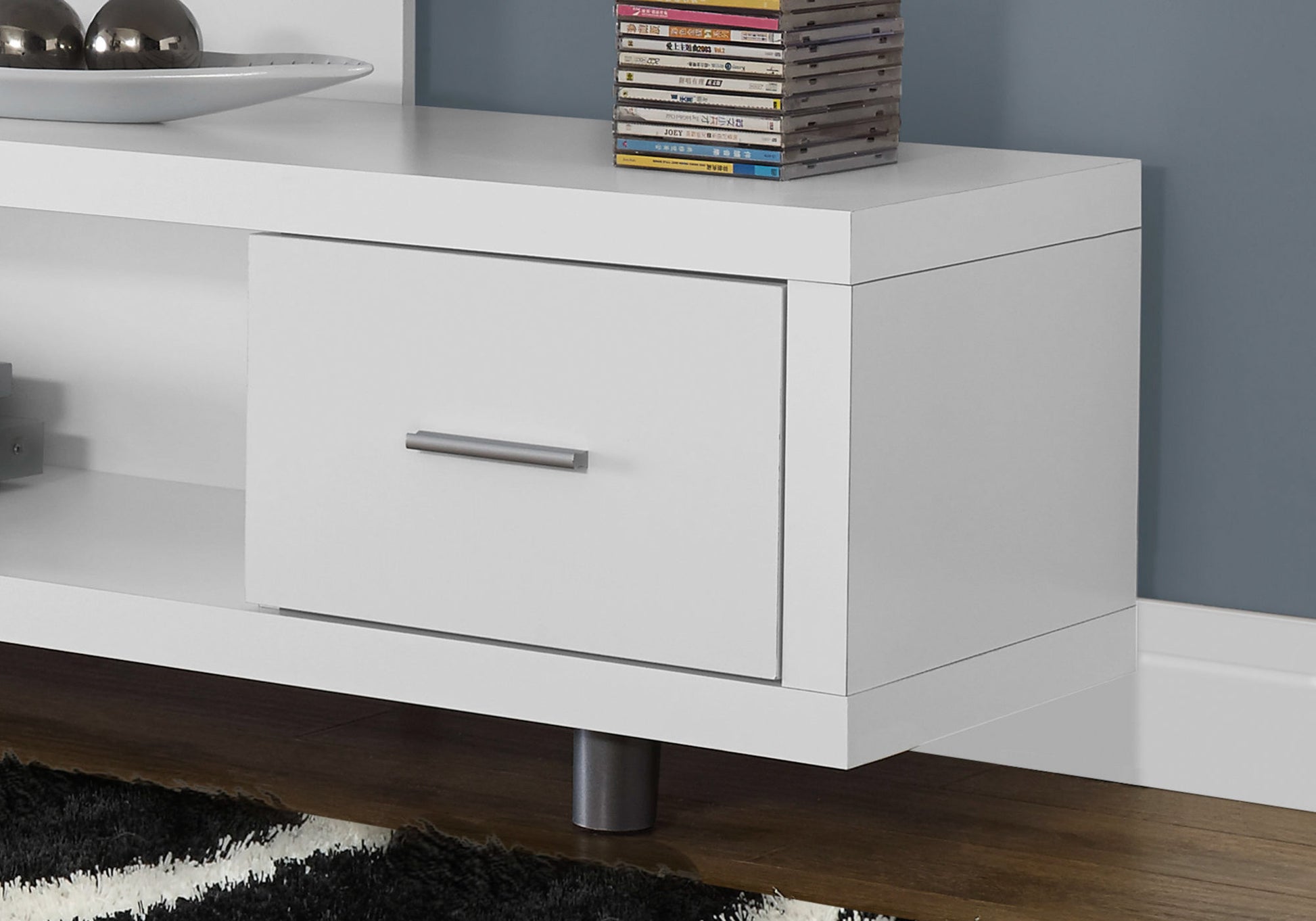Modern white media console with one drawer and silver handle