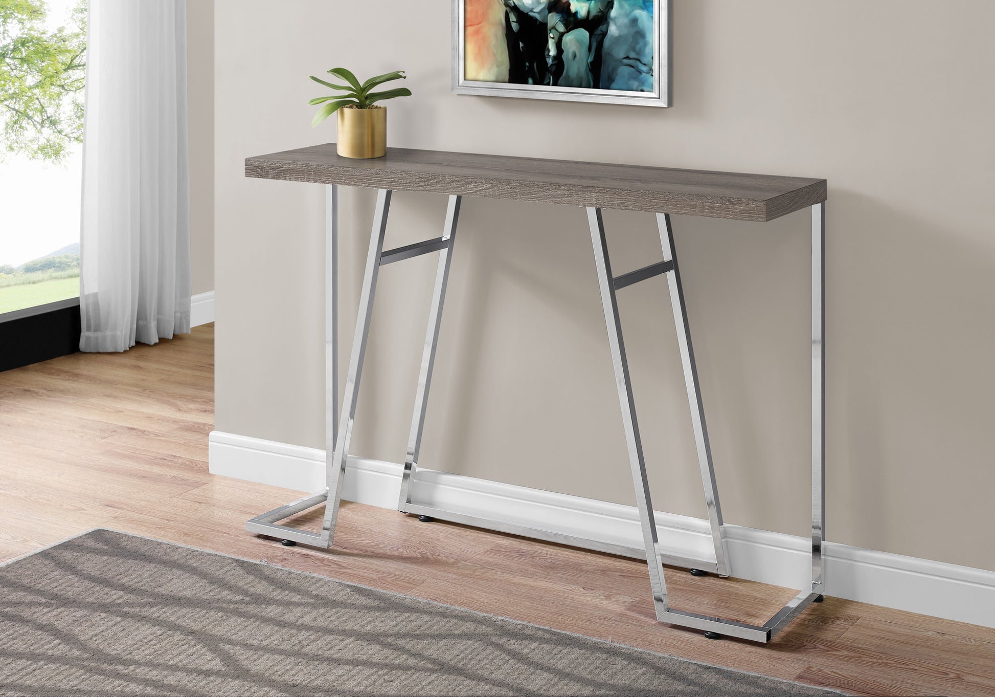 Modern grey wood grain console table with sleek chrome metal legs perfect for entryways