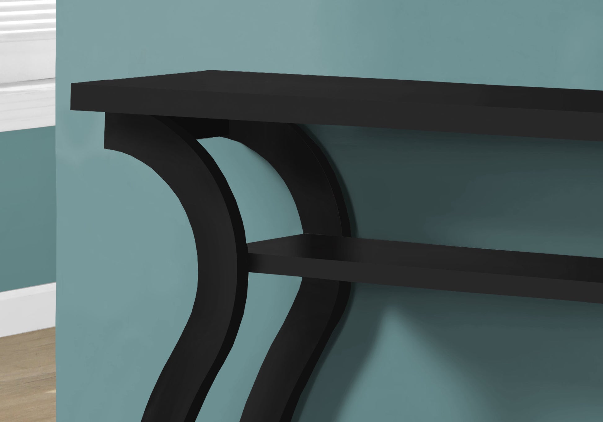 Sleek black modern console table with curved legs perfect for entryways