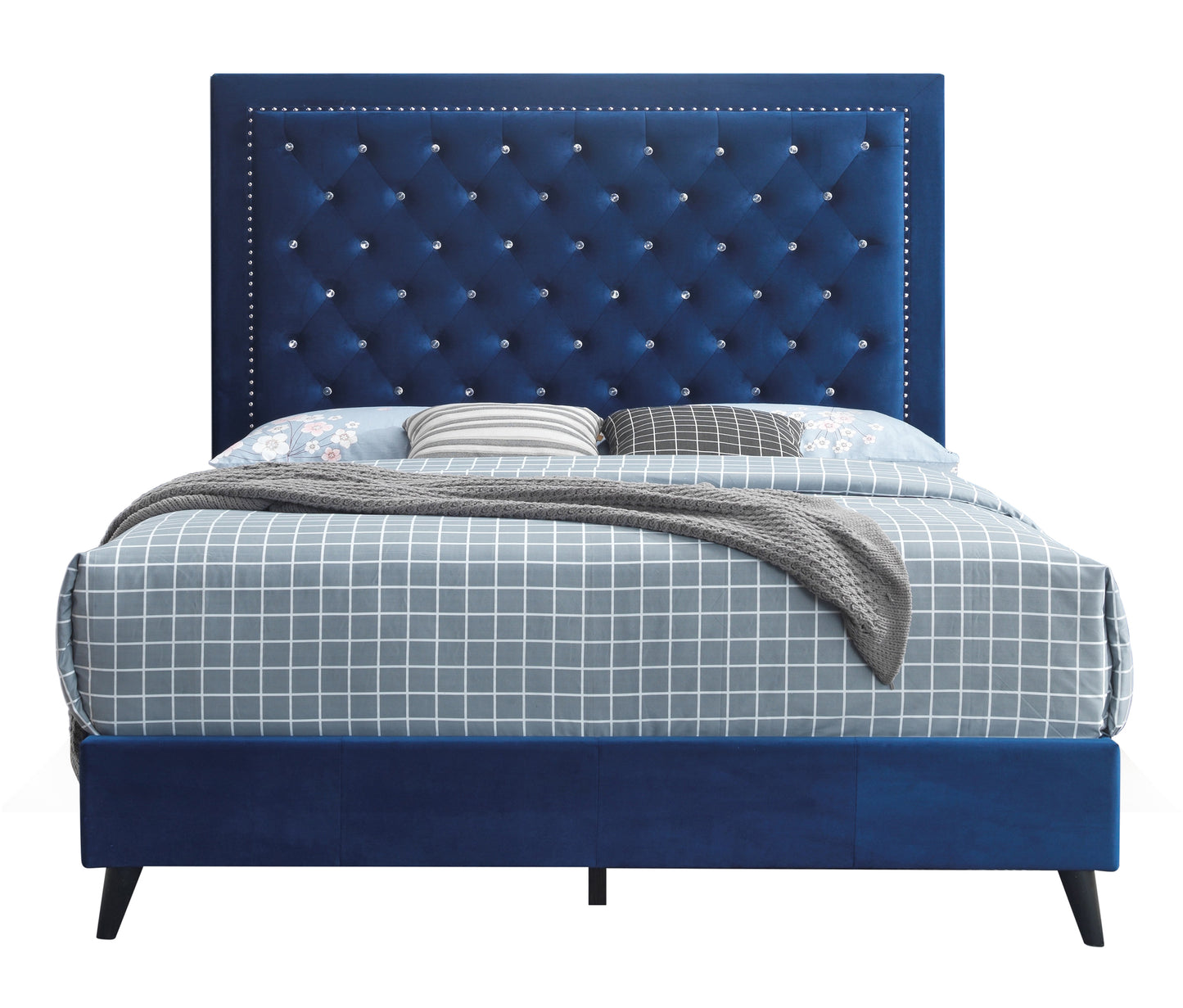 Deep blue velvet tufted king bed with crystal buttons and nailhead trim