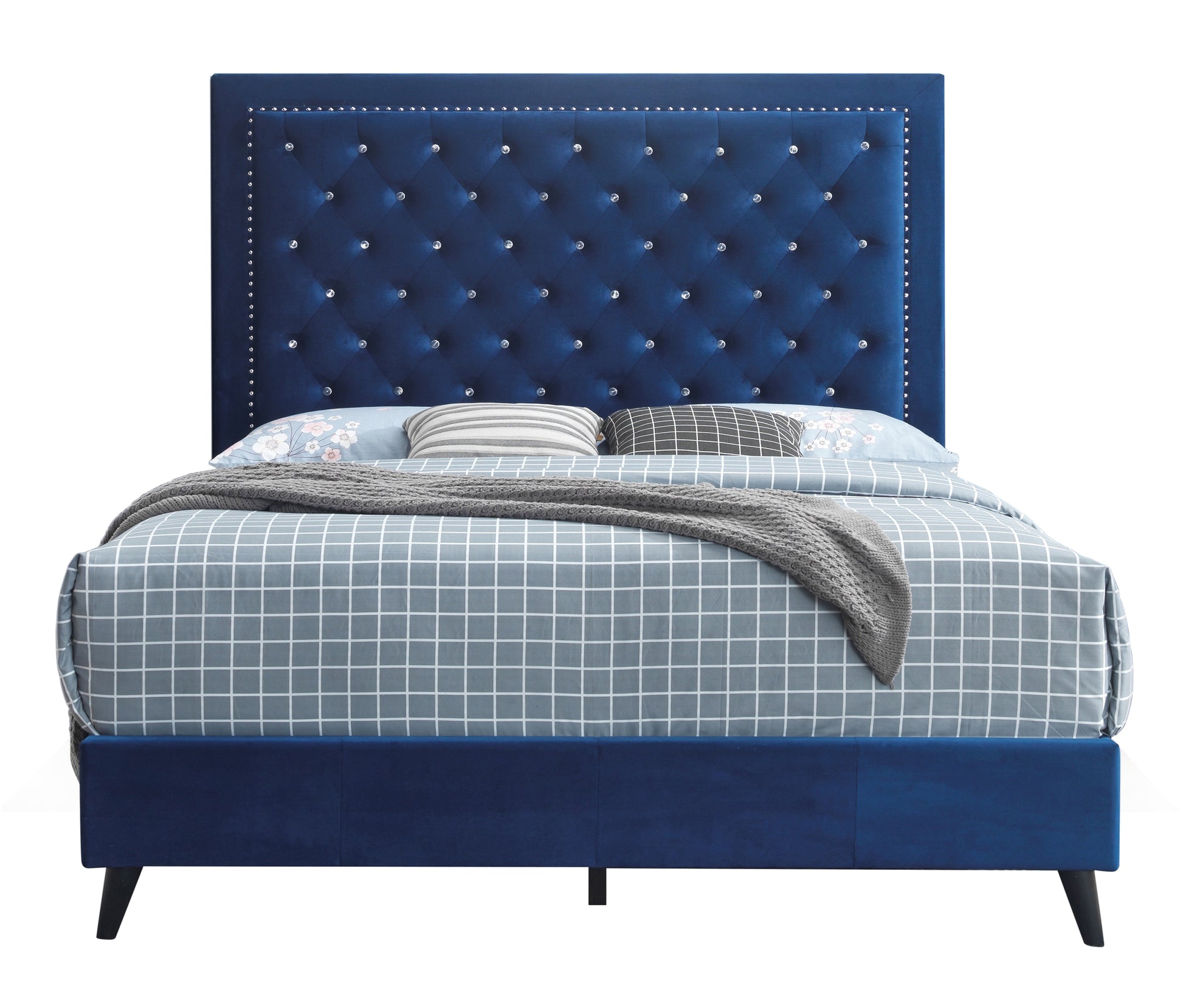 Deep blue velvet tufted king bed with crystal buttons and nailhead trim