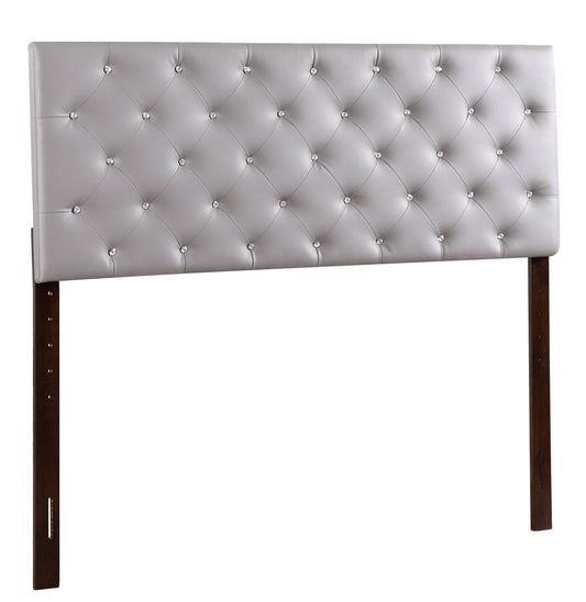 Light gray tufted faux leather headboard with crystal accents and dark wood posts