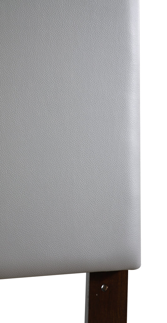 Closeup of a light gray textured vegan leather upholstery on a furniture leg
