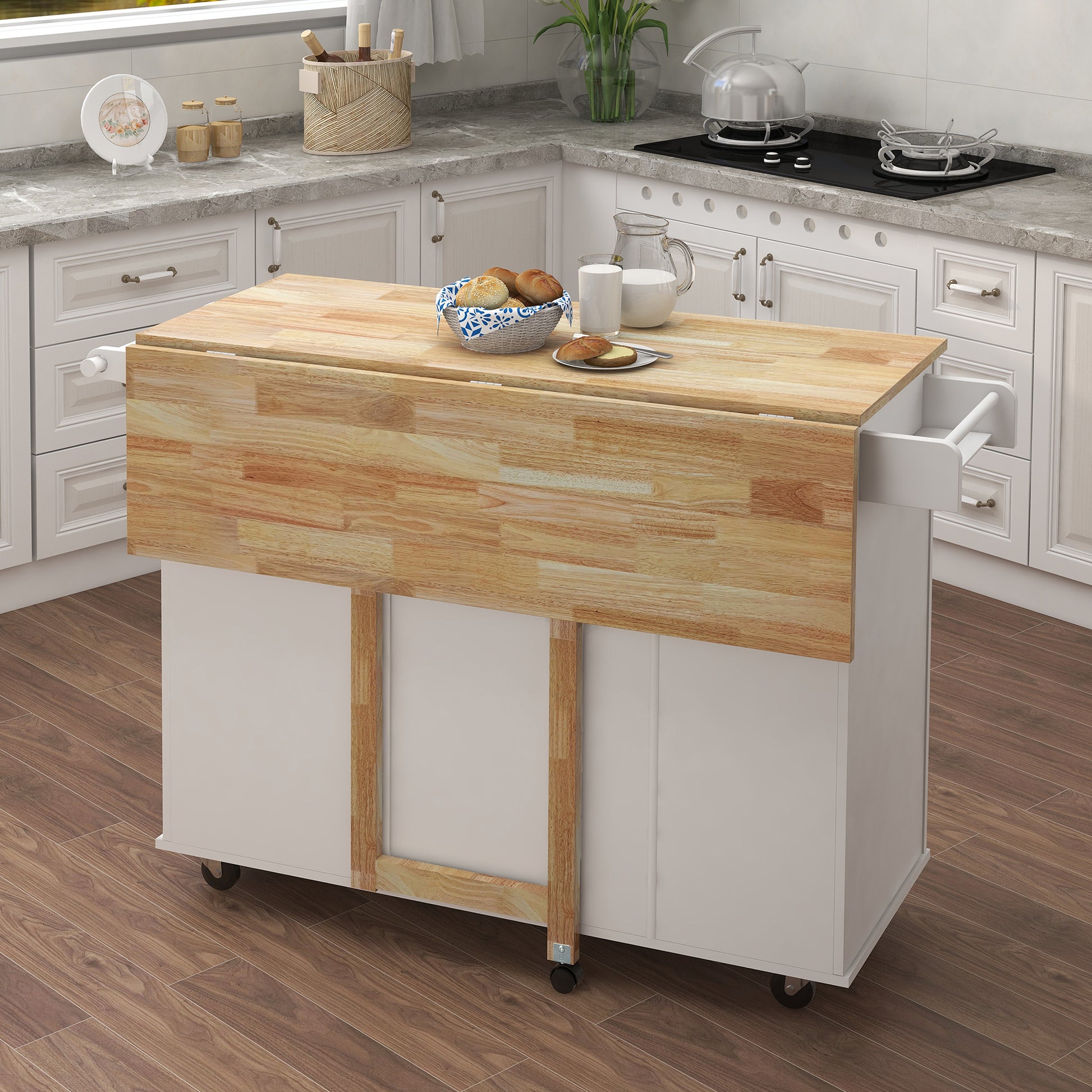 Compact kitchen island with dropleaf tabletop and casters