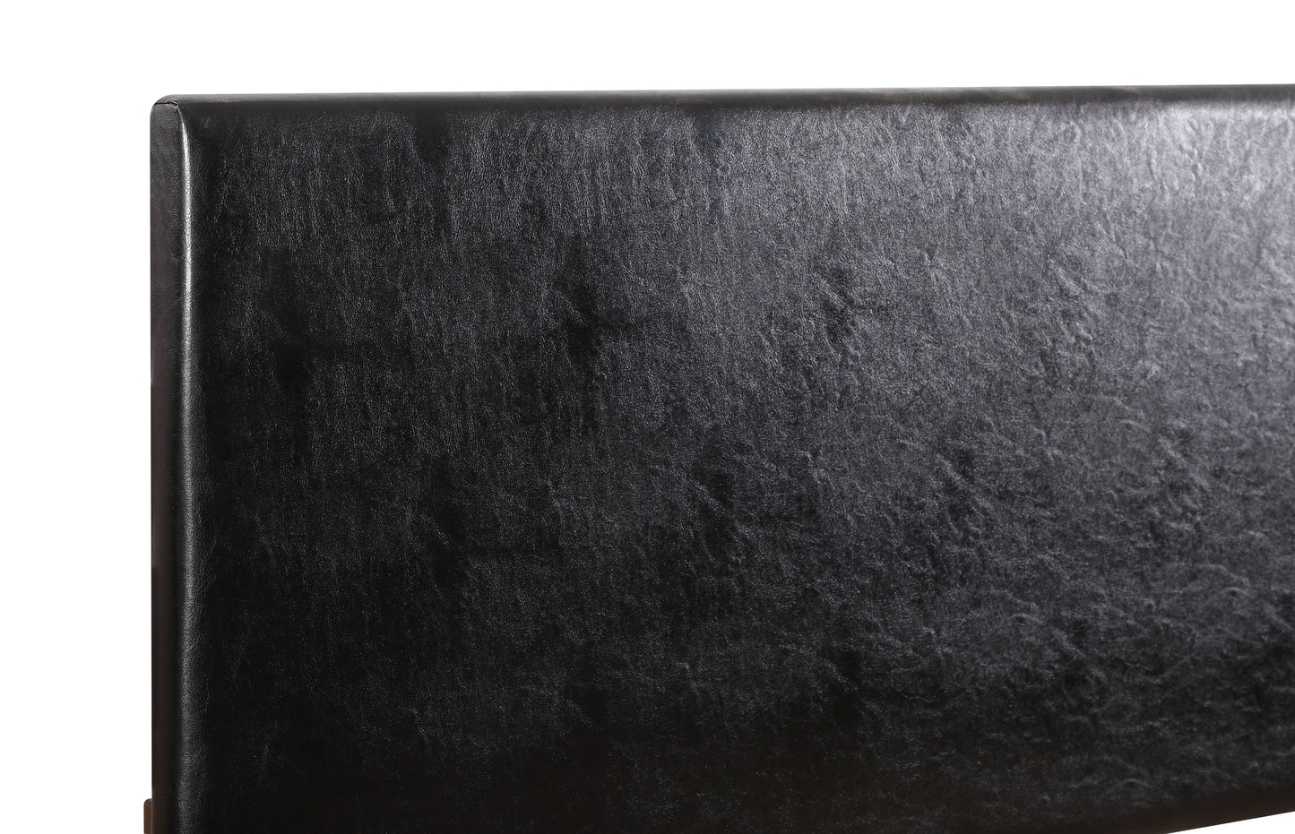 Closeup of a textured black faux leather headboard providing a luxurious feel