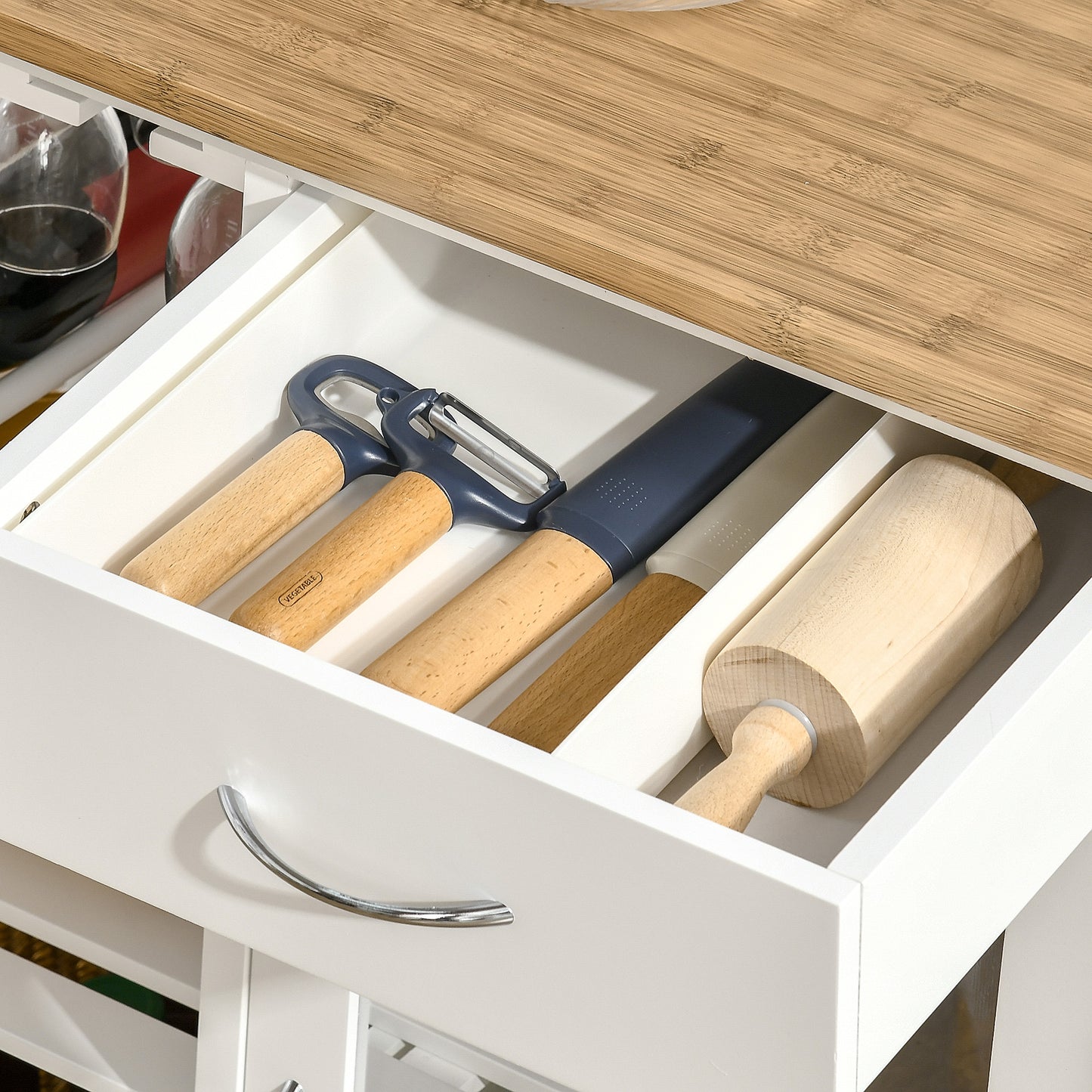 Wooden handled peeler and knife set with blue accents in kitchen drawer