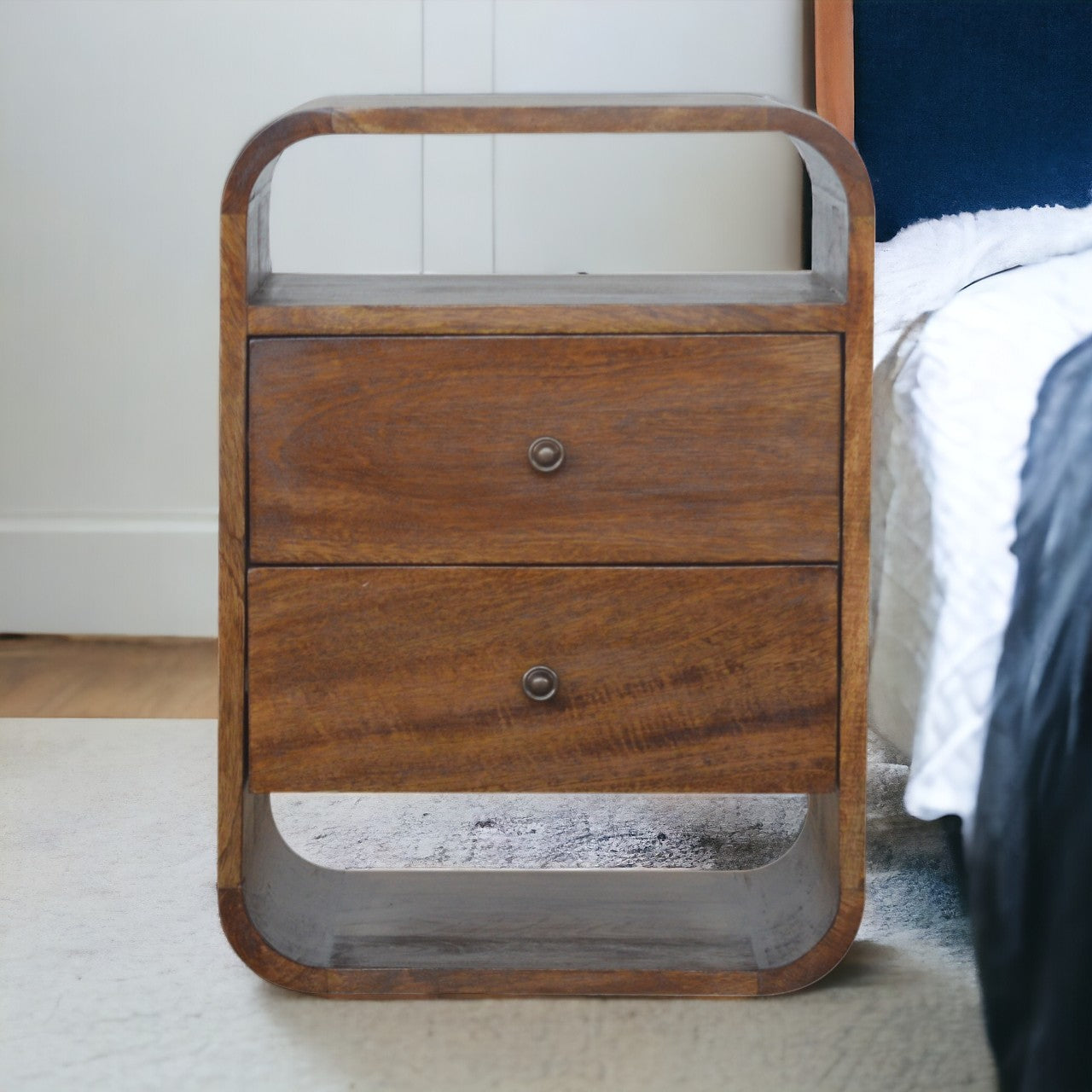 Rustic wooden bedside table with two drawers and open shelving featuring a curved design and natural wood grain finish